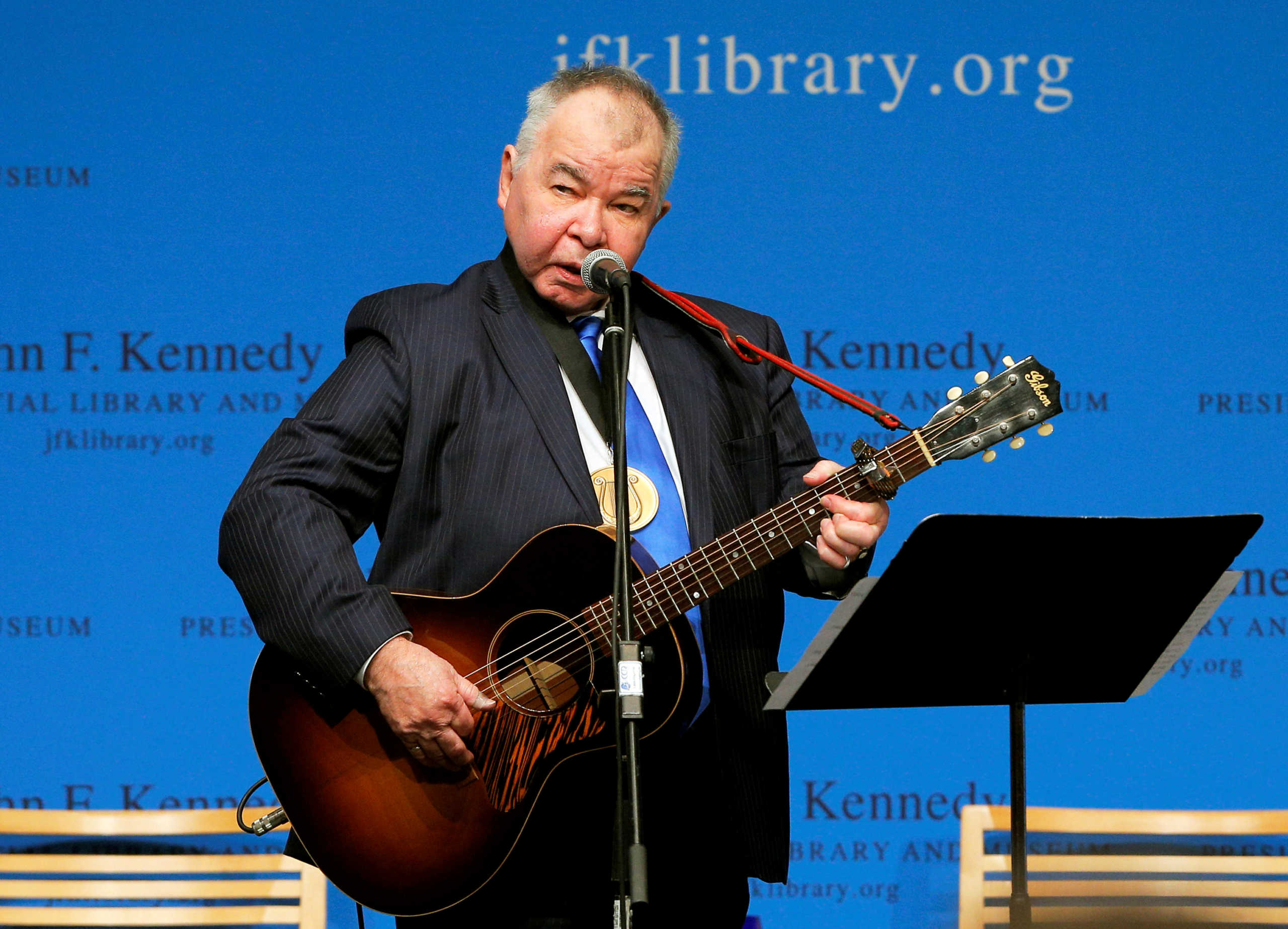 FILE PHOTO: Musician John Prine performs after accepting his PEN New England Song Lyrics of Literary Excellence Award during a ceremony at the John F. Kennedy Library in Boston, Massachusetts, U.S. September 19, 2016.  REUTERS