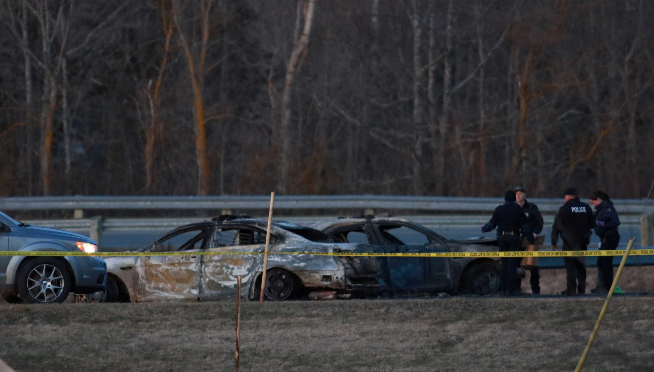 RCMP officers go over a car collision scene involving the fake RCMP car driven by Gabriel Wortman in Shubenacadie, Nova Scotia, Canada April 19, 2020. REUTERS