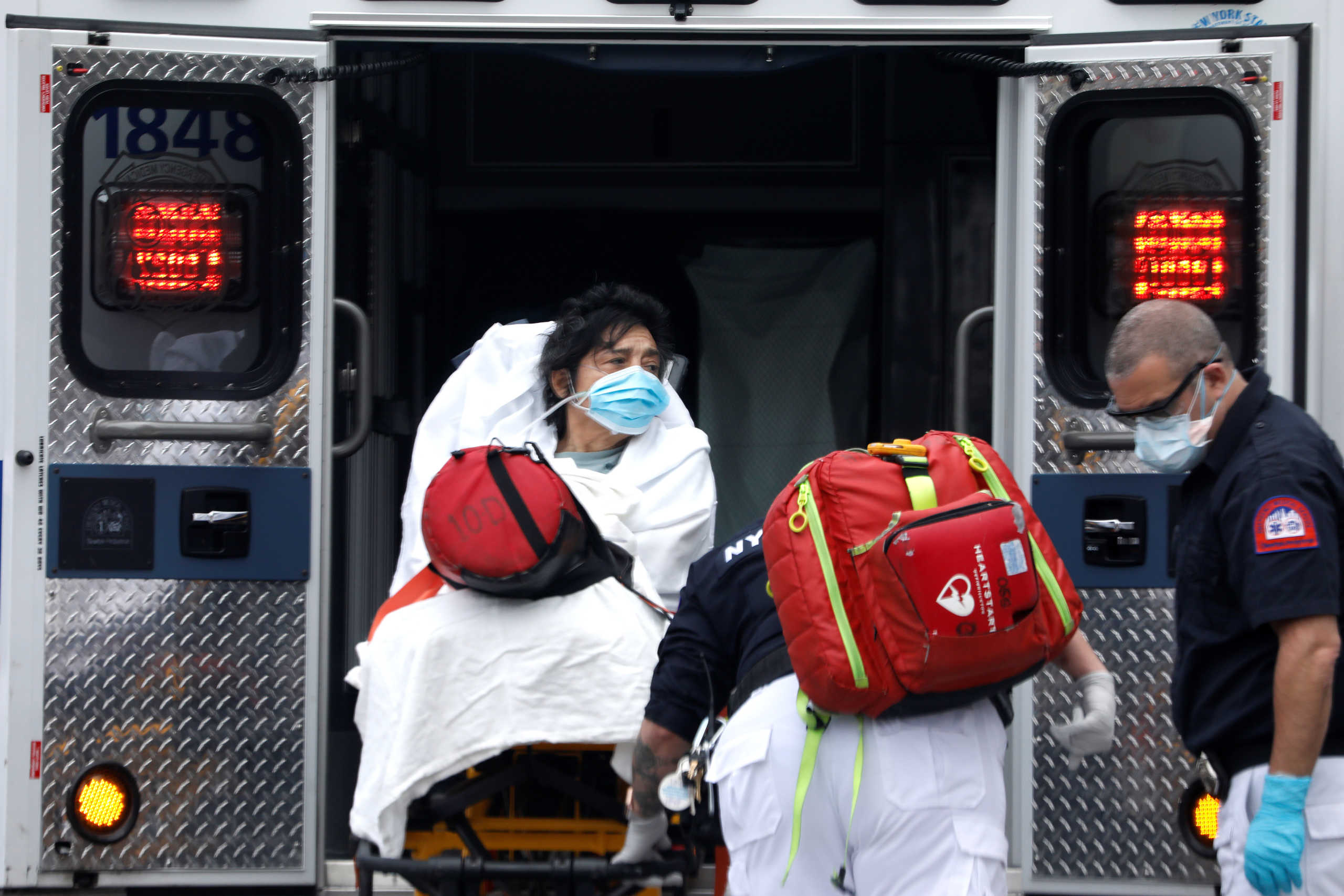 A woman is loaded into an ambulance by paramedics in the Harlem neighbourhood of Manhattan during the outbreak of the coronavirus disease (COVID19) in New York City, New York, U.S., April 8, 2020. REUTERS