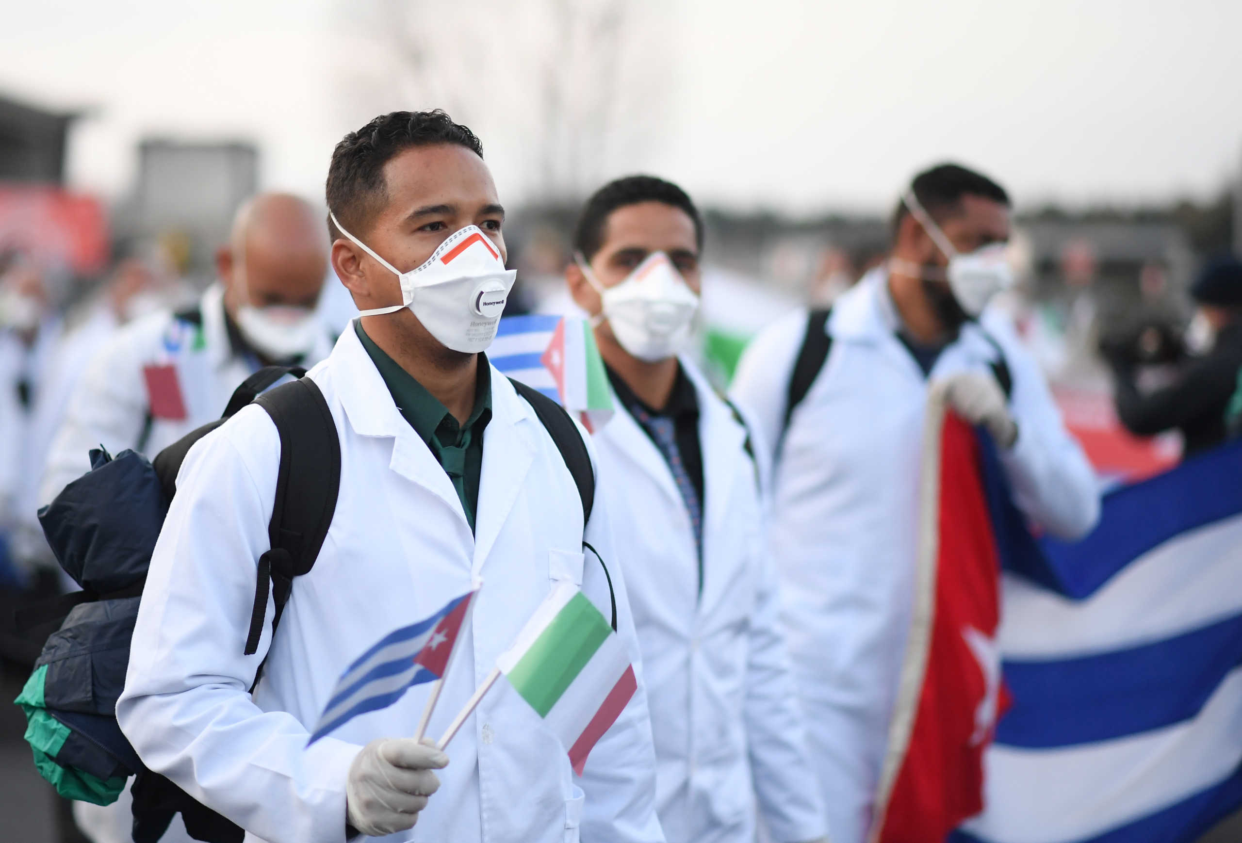An emergency contingent of Cuban doctors and nurses arrive at Italy's Malpensa airport after travelling from Cuba to help Italy battle the spread of coronavirus disease (COVID-19), near Milan, Italy, March 22, 2020. REUTERS