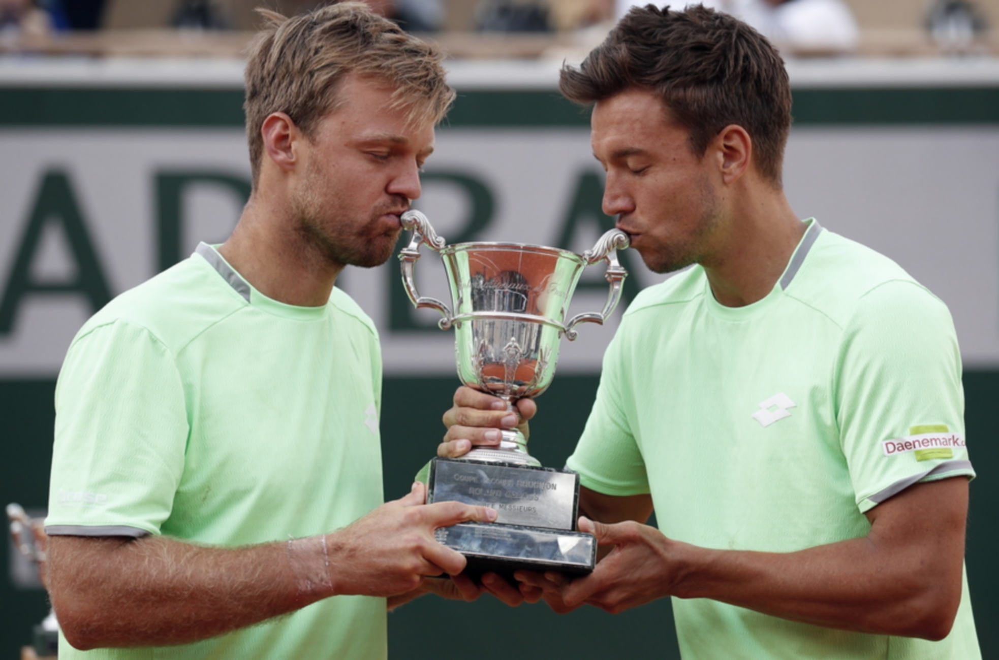 epa07635639 Kevin Krawietz (L) and Andreas Mies of Germany pose with the trophy after winning the men’s doubles final match during the French Open tennis tournament at Roland Garros in Paris, France, 08 June 2019.  EPA