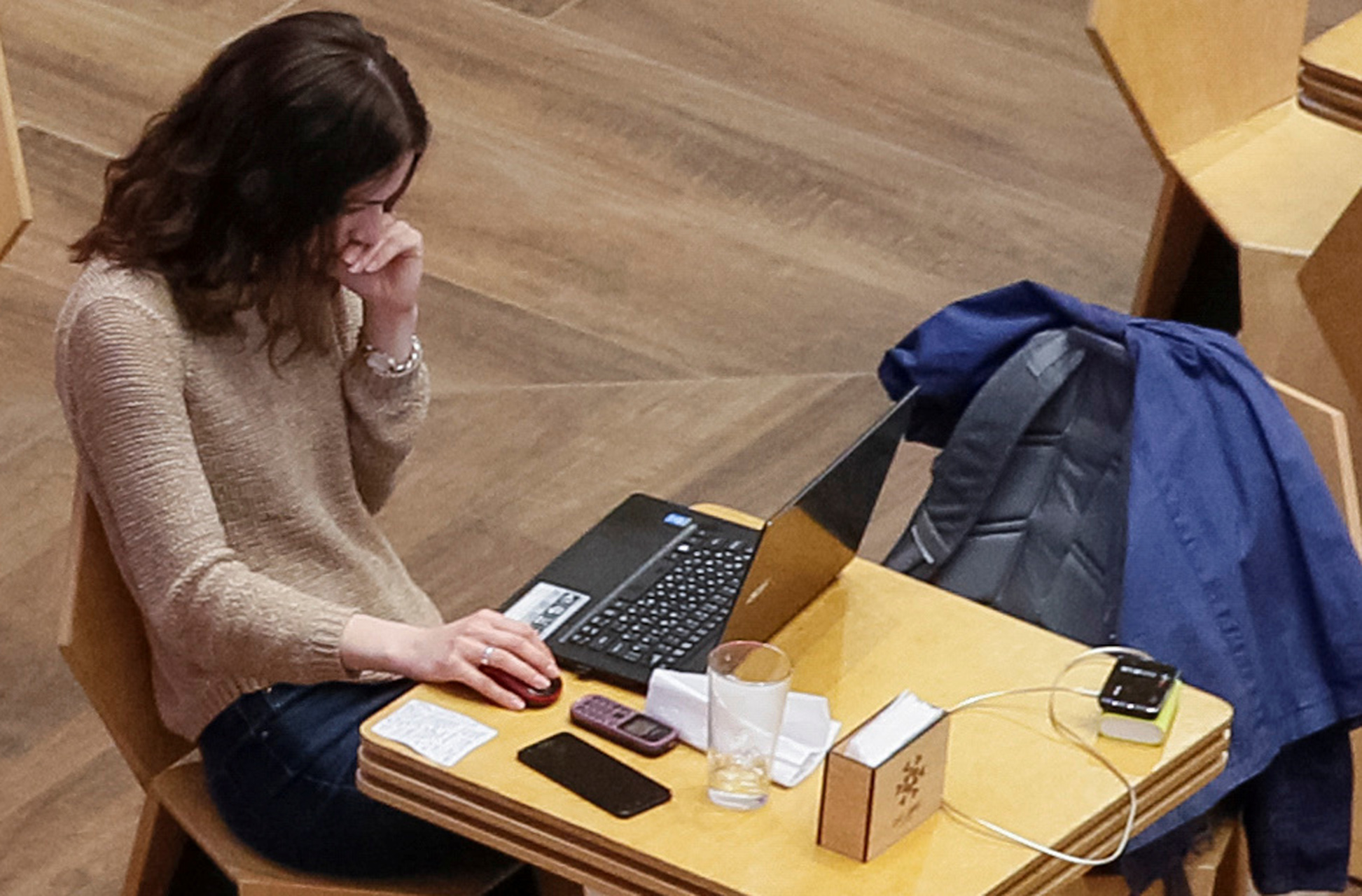 A woman uses a laptop at a cafe in the Central Universal Department Store (TsUM) in Kiev, Ukraine May 17, 2017. Picture taken May 17, 2017. REUTERS