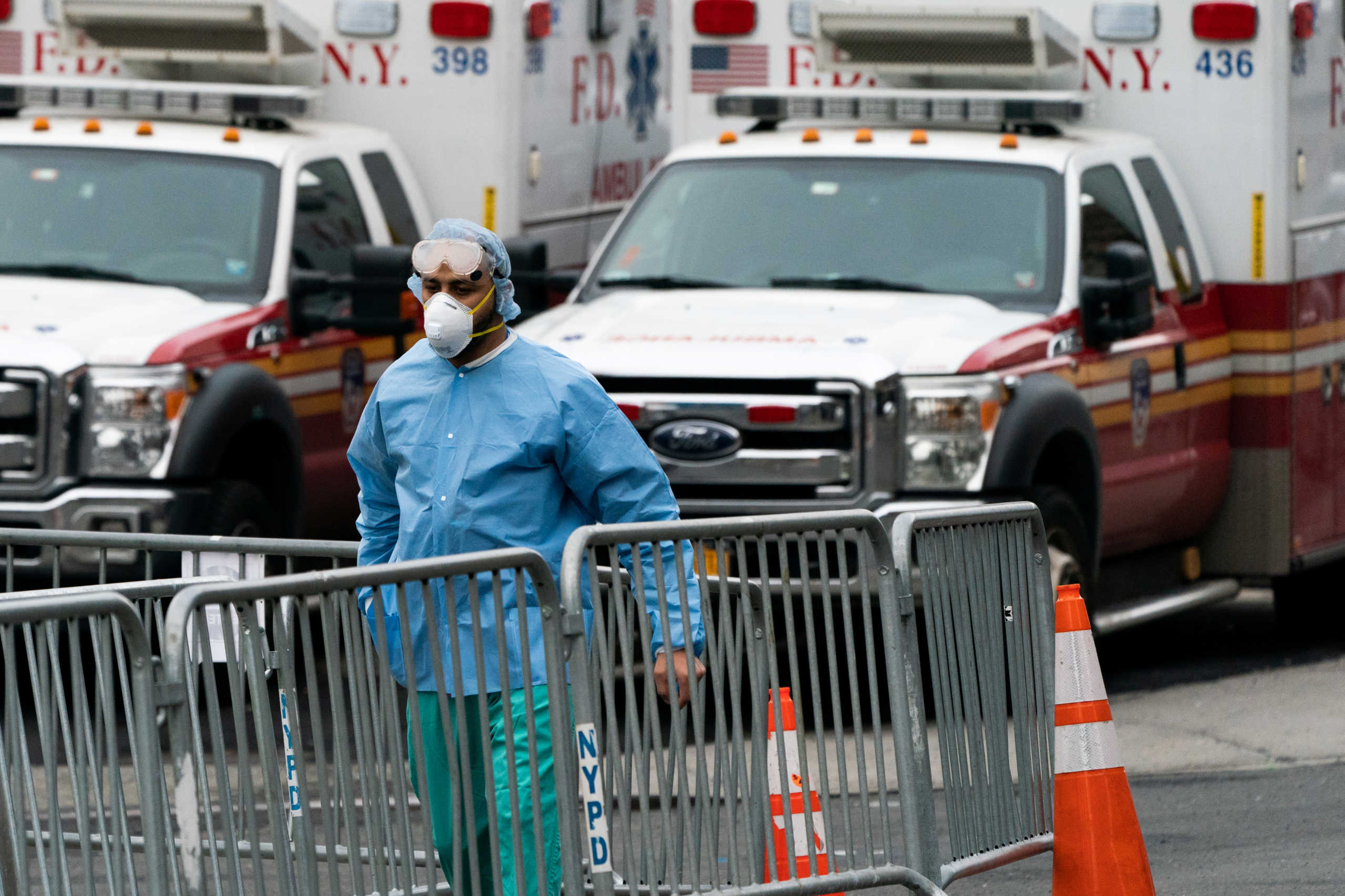 A nurse wearing a protective mask is seen outside Elmhurst Hospital Center in the Queens borough of New York City, U.S., March 30, 2020. REUTERS