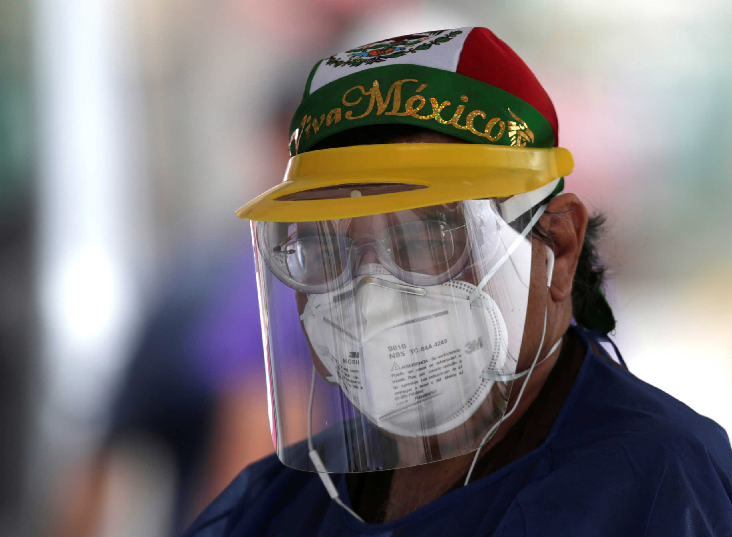 A health worker wearing a protective face mask is seen at a drive-thru testing while the spread of the coronavirus disease (COVID-19) continues, in Monterrey, Mexico April 11, 2020. REUTERS