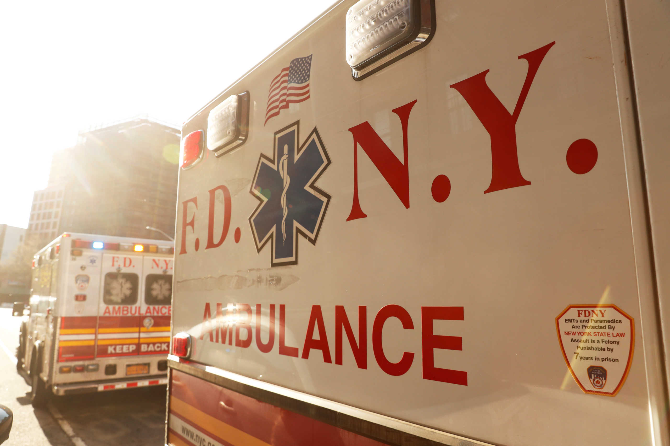 A New York City Fire Department (FDNY) ambulances stand outside after the Emergency Medical Technicians (EMT) went inside a building to assist a woman who was having difficulty breathing during ongoing outbreak of the coronavirus disease (COVID19) in New York, U.S., April 15, 2020. REUTERS