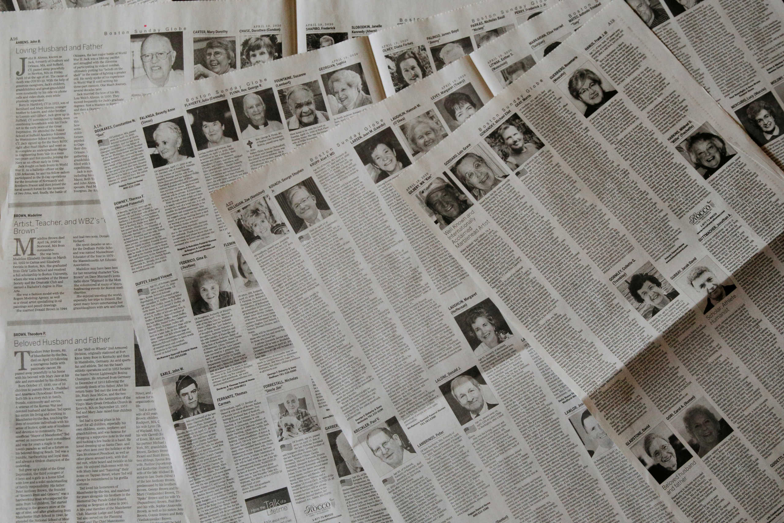The April 19, 2020 Sunday Boston Globe has 16 pages dedicated to obituaries in this picture illustration taken April 20, 2020. REUTERS