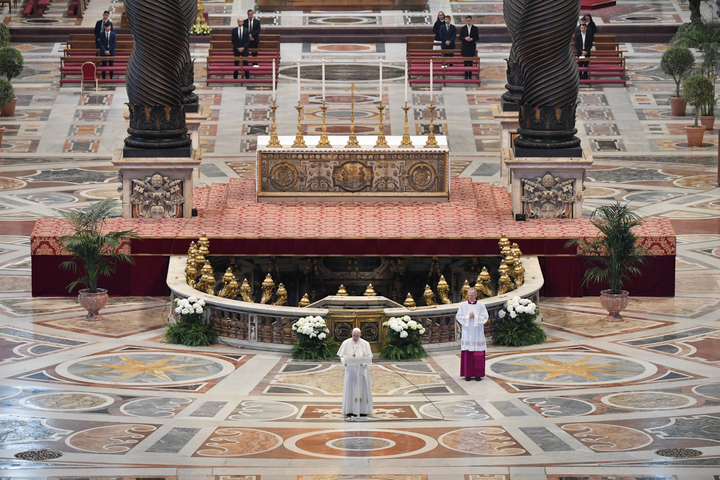 Pope Francis reads his "Urbi et Orbi" ("To the City and the World") message in St. Peter's Basilica with no public participation due to an outbreak of the coronavirus disease (COVID-19) on Easter Sunday at the Vatican, April 12, 2020. Vatican Media