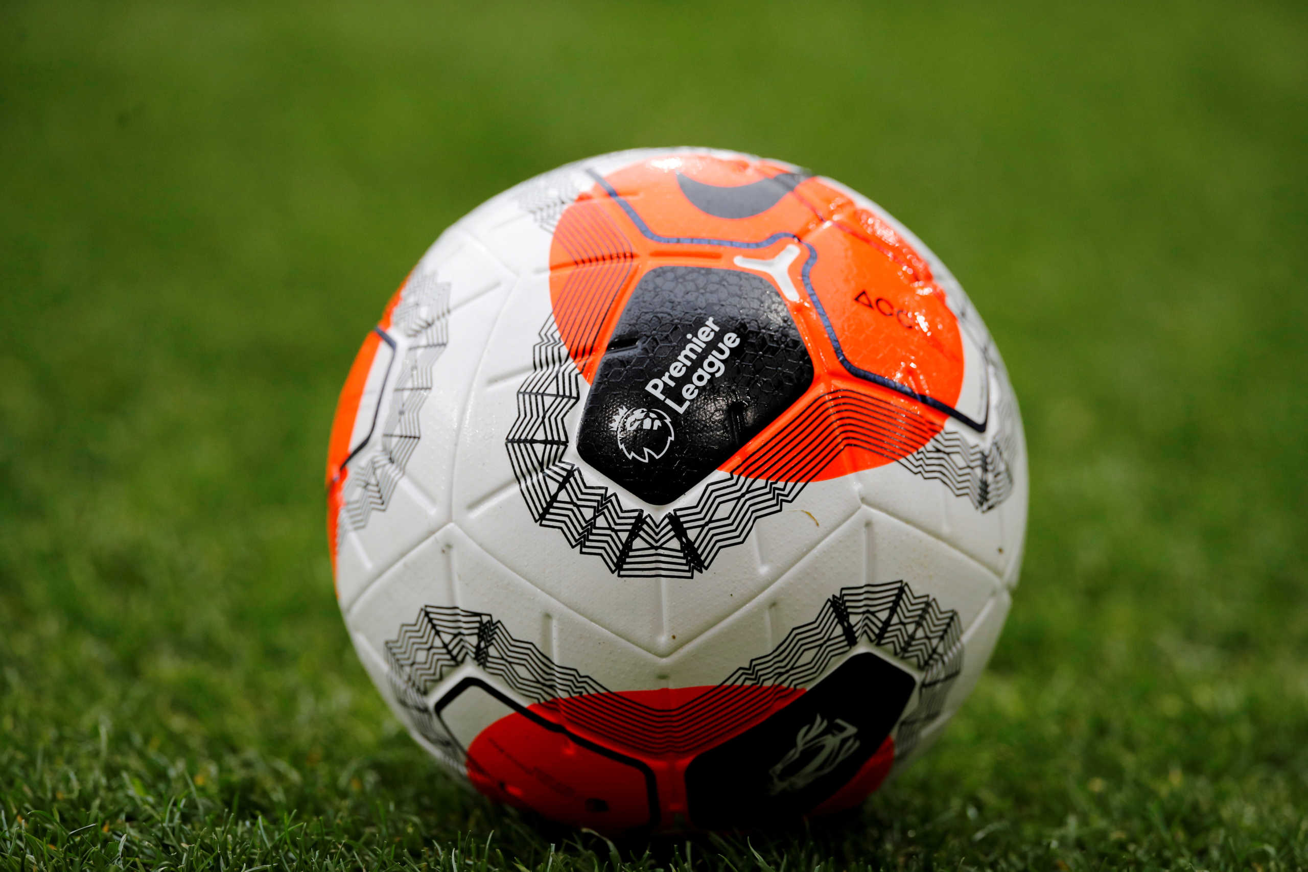 FILE PHOTO: Soccer Football - Premier League - Burnley v AFC Bournemouth - Turf Moor, Burnley, Britain - February 22, 2020  General view of the Premier League logo on a match ball before the match   REUTERS
