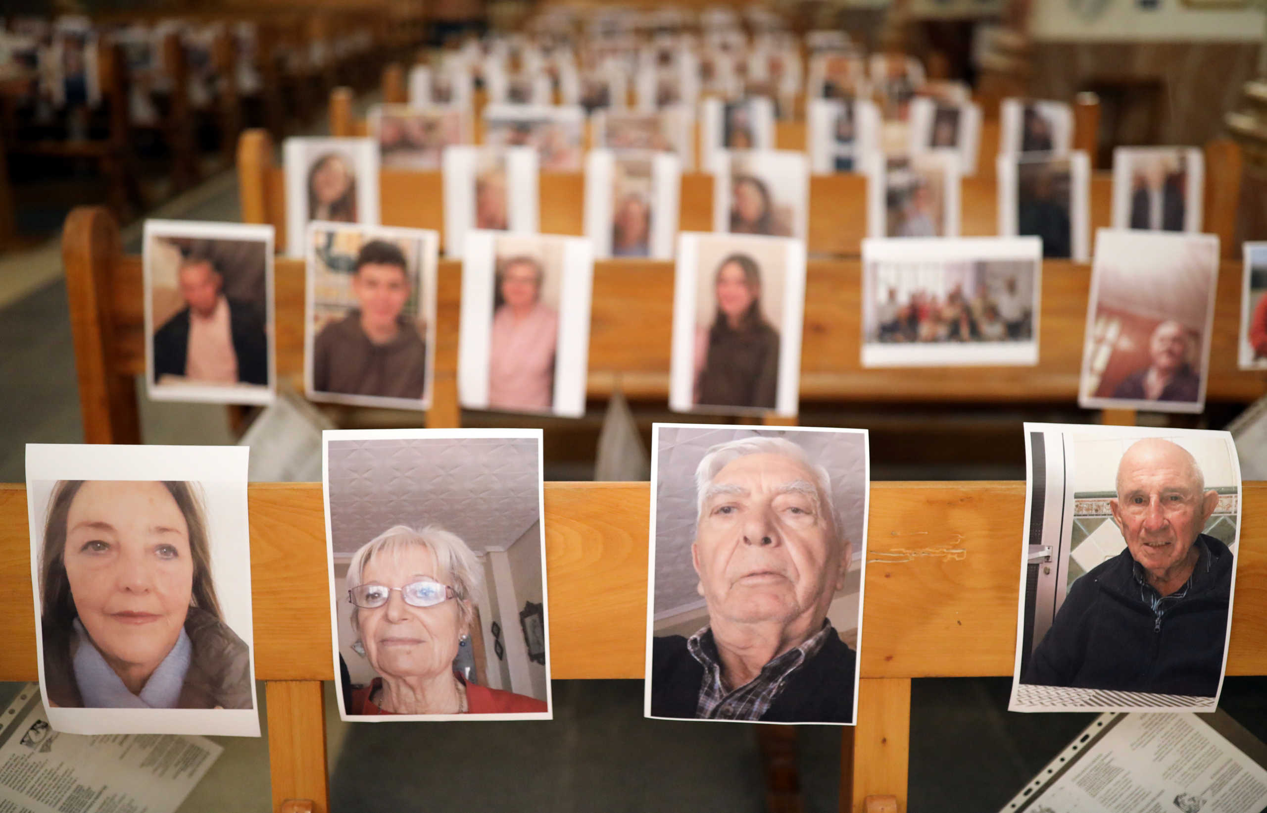 A view shows pictures of the faithful of the Nuestra Senora de la Paz church, placed on the church's benches, as priest Raul Garcia officiates a Holy Week mass, during the coronavirus disease (COVID-19) outbreak, in the Villar del Arzobispo village, near Valencia, Spain April 9, 2020. REUTERS