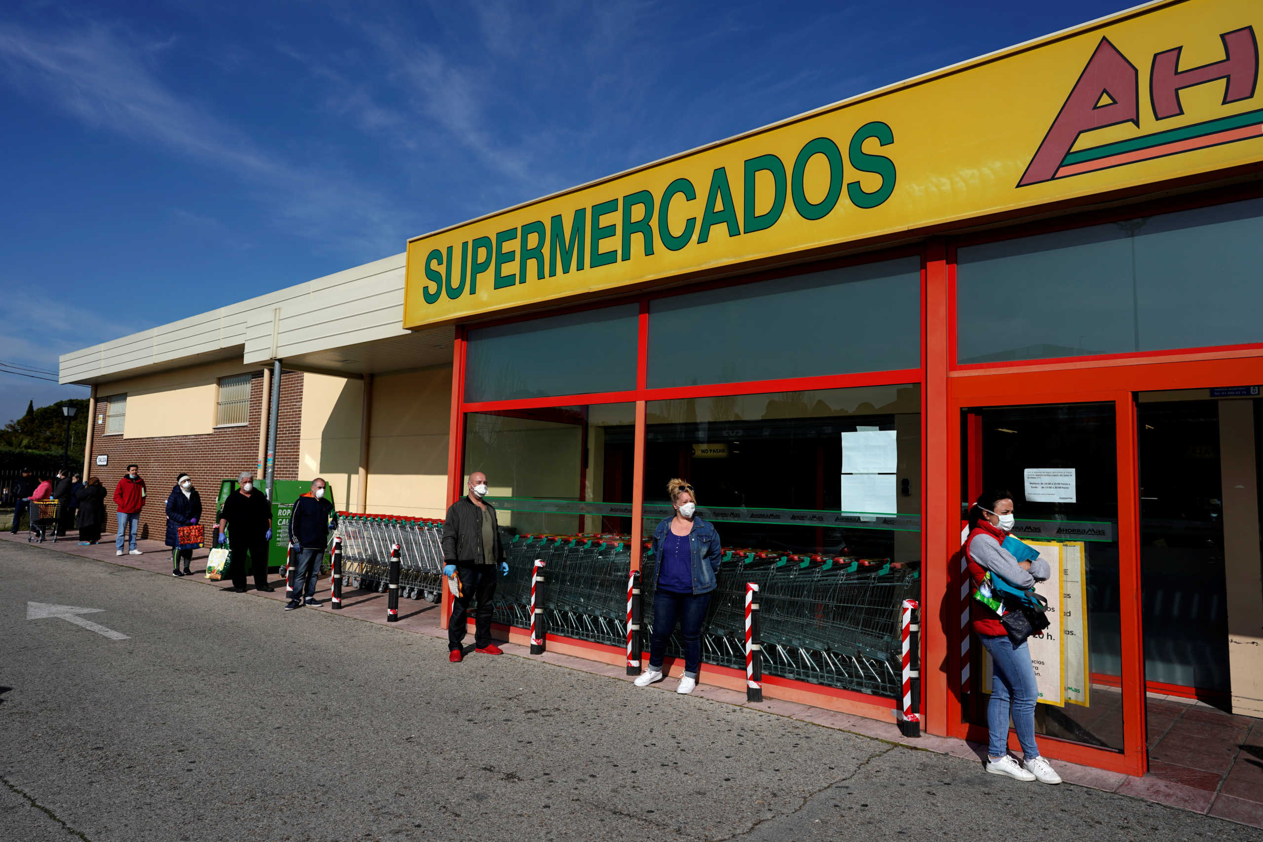 People practice social distancing as they wait to enter a supermarket during the coronavirus disease (COVID-19) outbreak in Grinon, Spain April 8, 2020. REUTERS