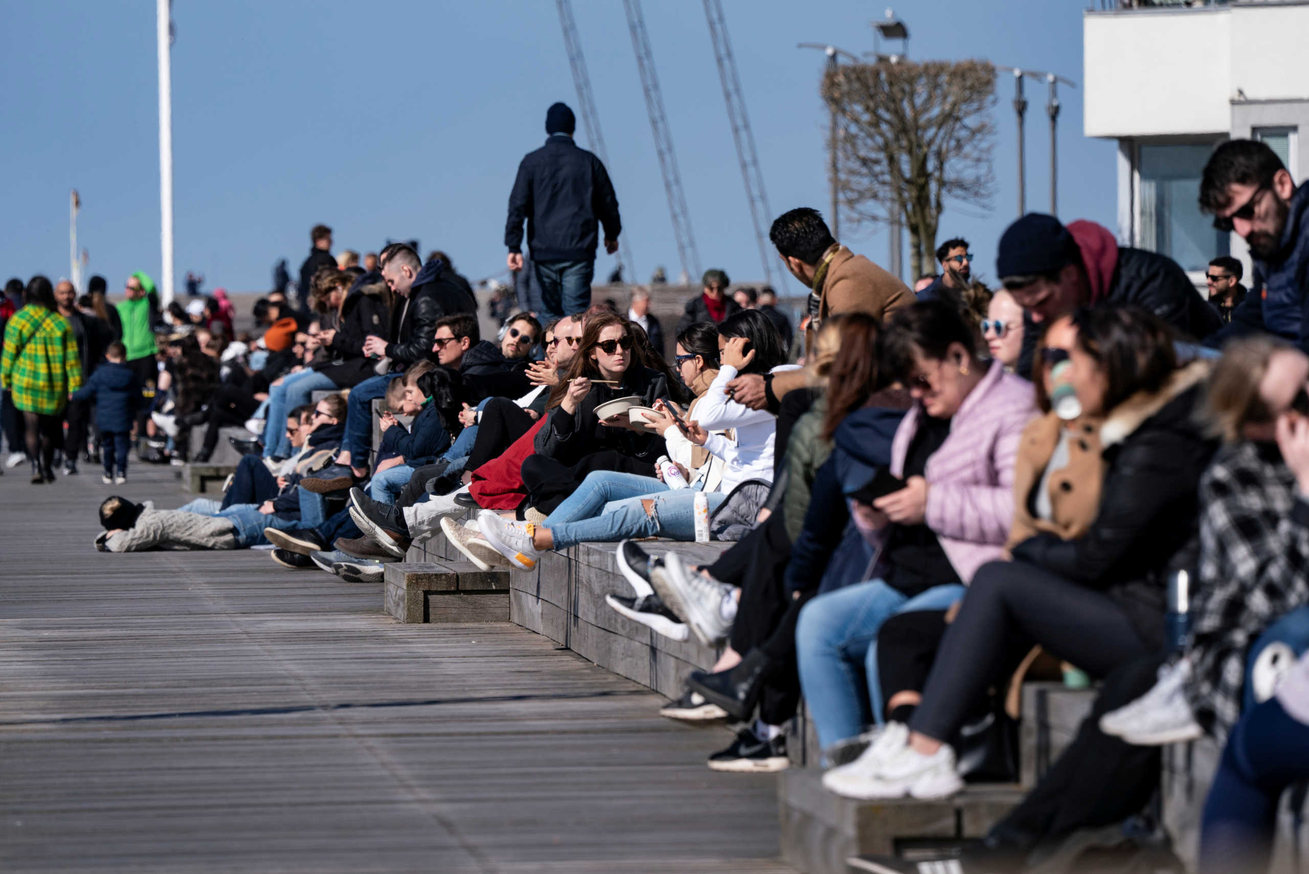 People enjoy the sun, as the spread of the coronavirus disease (COVID-19) continues,  in Malmo, Sweden April 5, 2020.  TT News Agency