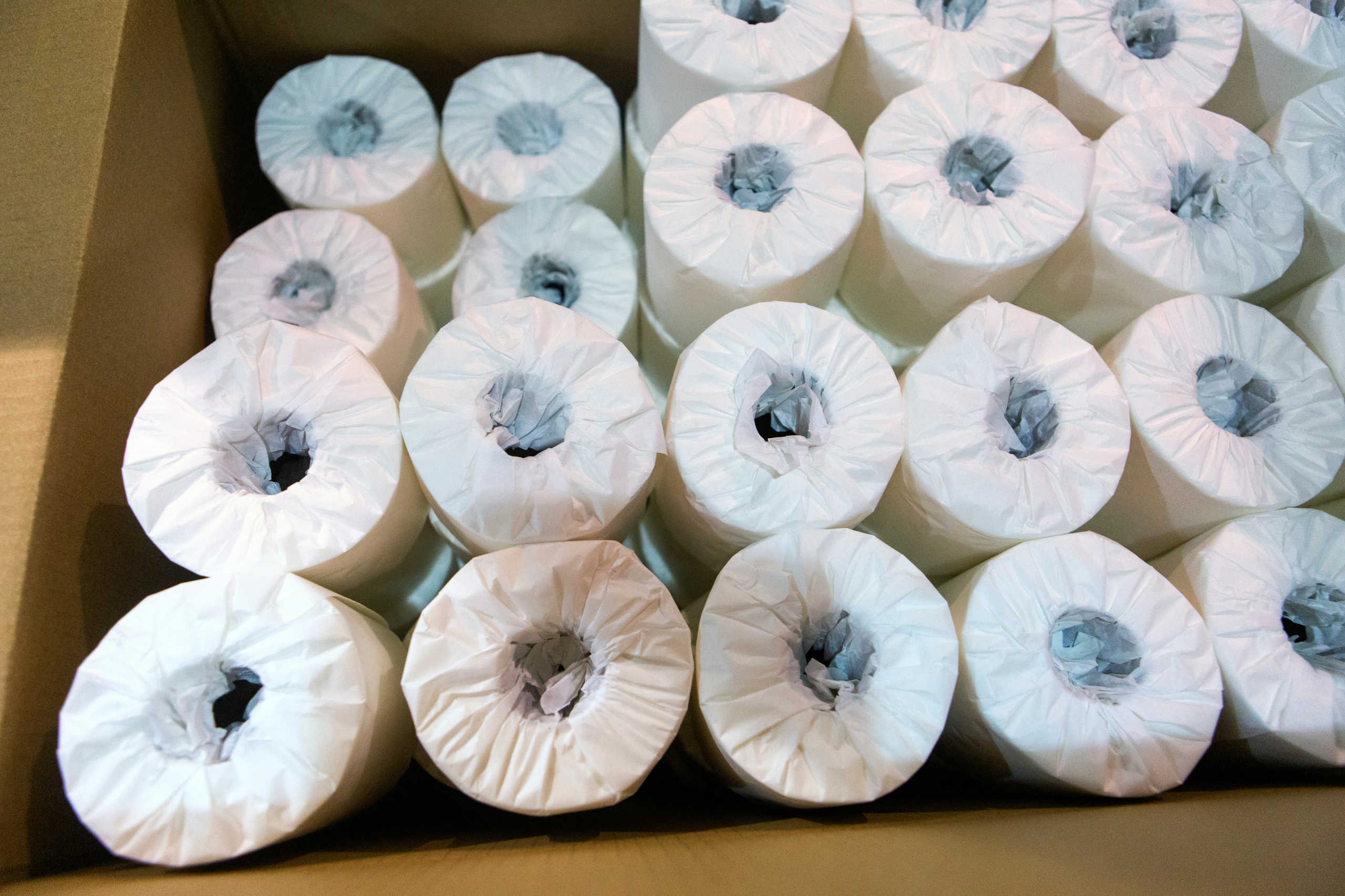 Rolls of individually wrapped toilet paper are boxed up to be shipped to consumers at Tissue Plus in Bangor, Maine, U.S. April 7, 2020.  REUTERS