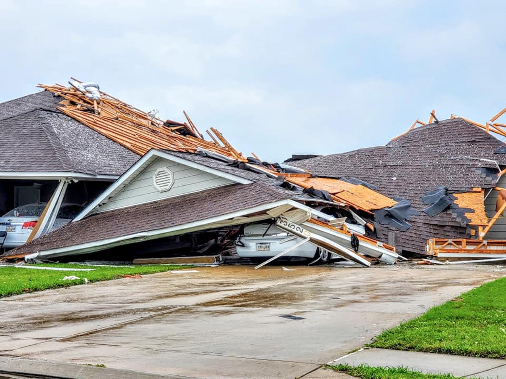 Damaged buildings and vehicles are seen in the aftermath of a tornado in Monroe, Louisiana, U.S. April 12, 2020, in this still image obtained from social media. Courtesy of Peter Tuberville