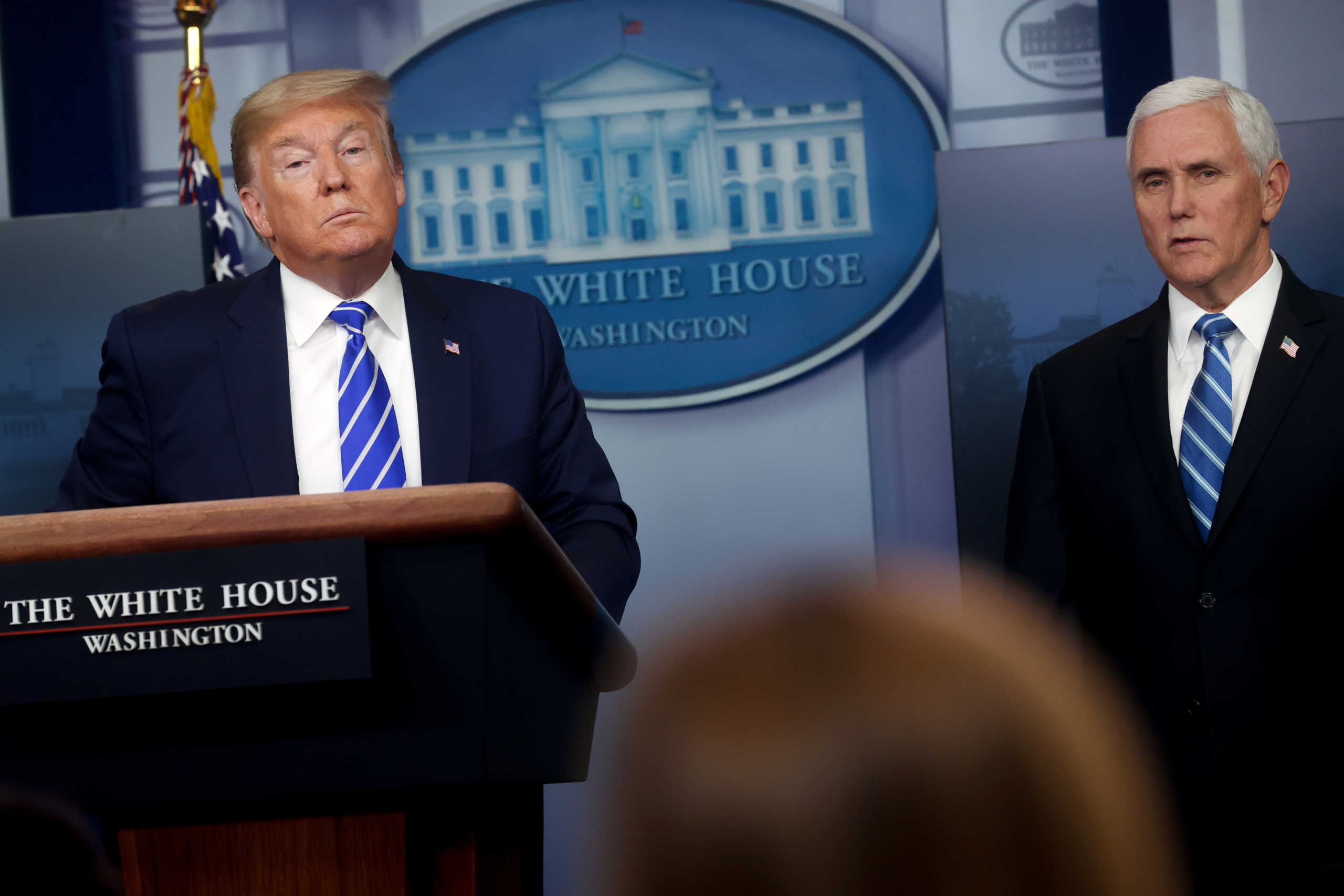 U.S. President Donald Trump listens to a question with Vice President Mike Pence during the daily coronavirus disease (COVID-19) outbreak task force briefing at the White House in Washington, U.S. April 23, 2020.  REUTERS