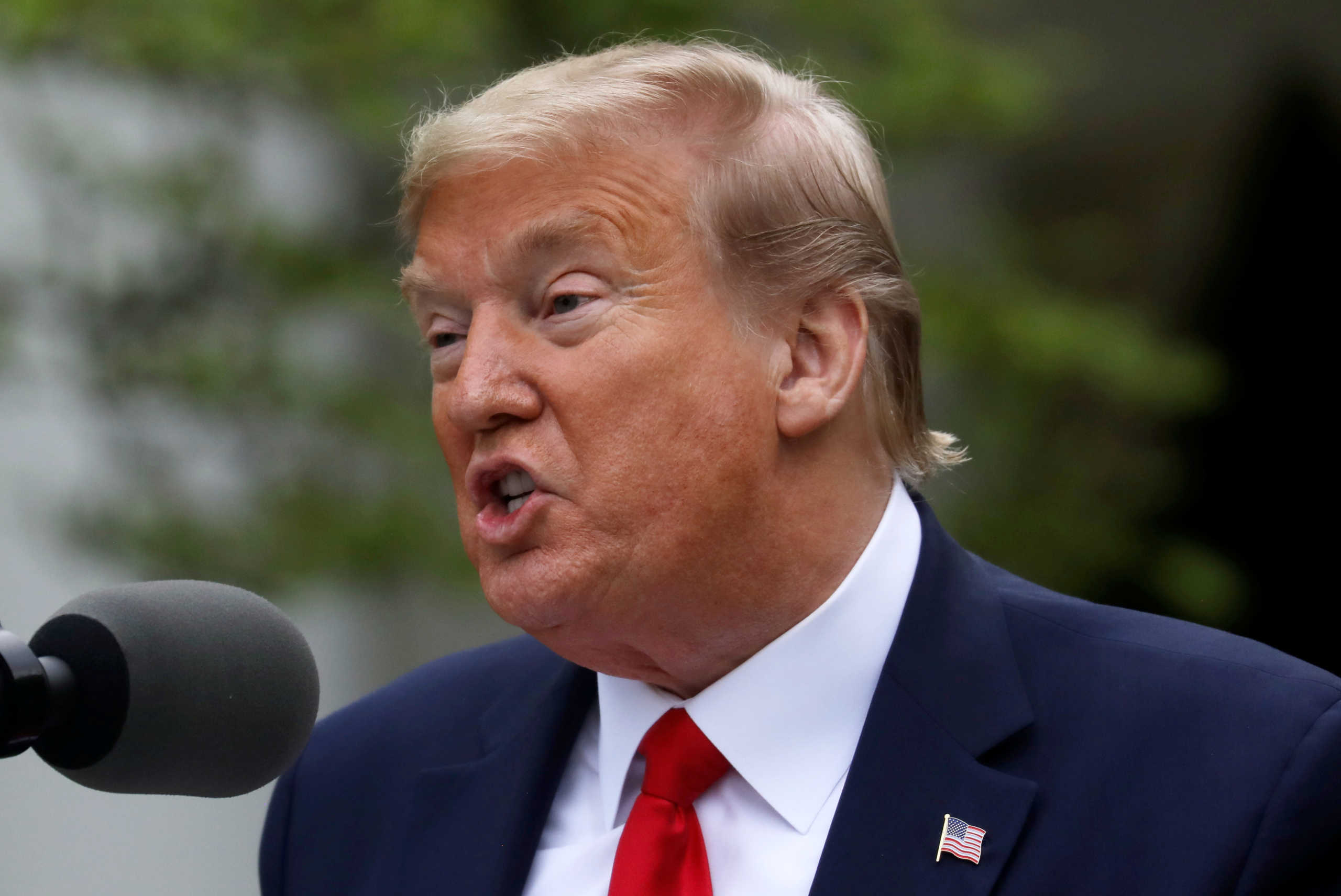 U.S. President Donald Trump addresses the daily coronavirus task force briefing in the Rose Garden at the White House in Washington, U.S., April 14, 2020. REUTERS