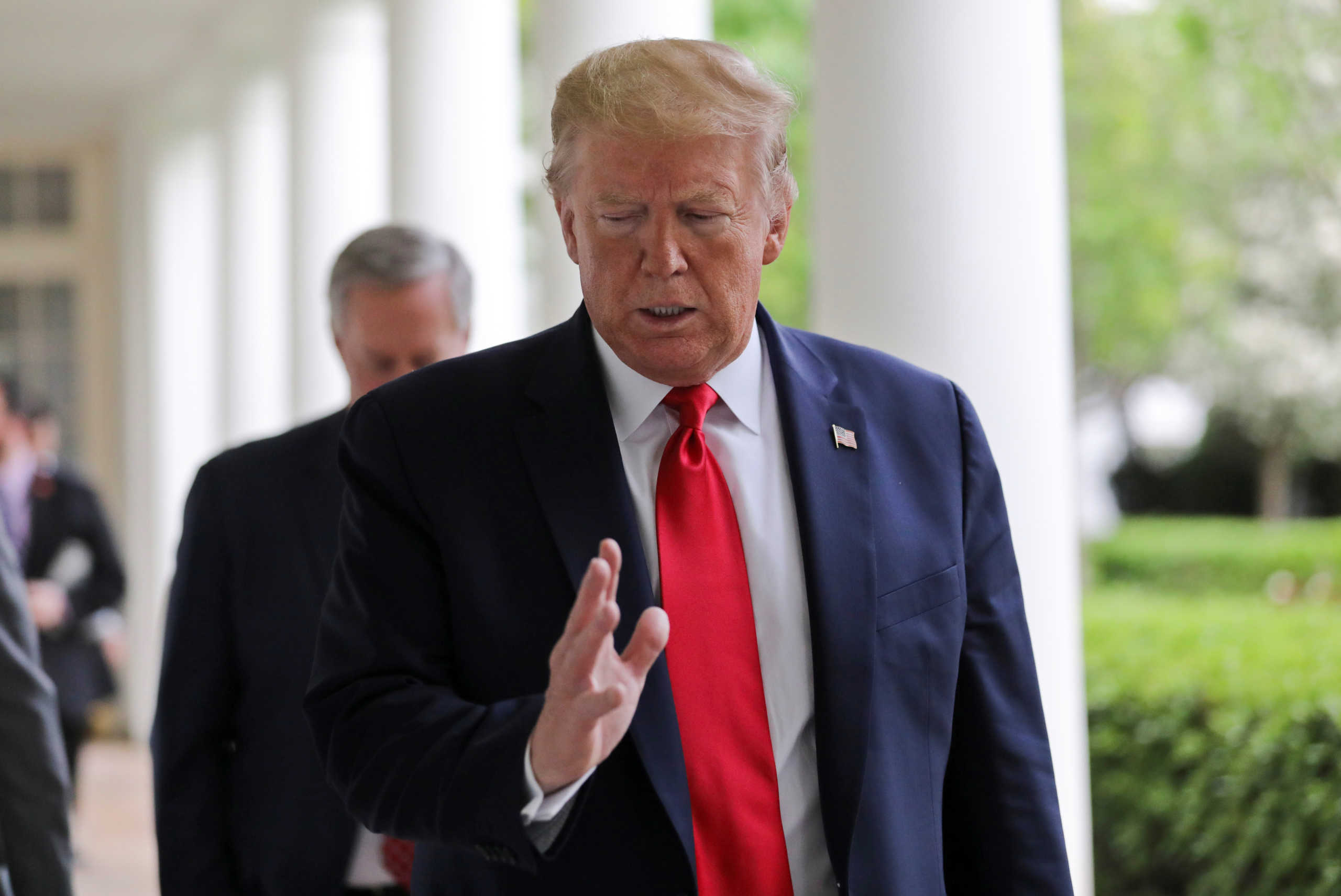 U.S. President Donald Trump talks with a Reuters reporter as they walk down the West Wing colonnade before an interview about China, the novel coronavirus (COVID-19) pandemic and other subjects in the Oval Office of the White House in Washington, U.S., April 29, 2020. REUTERS