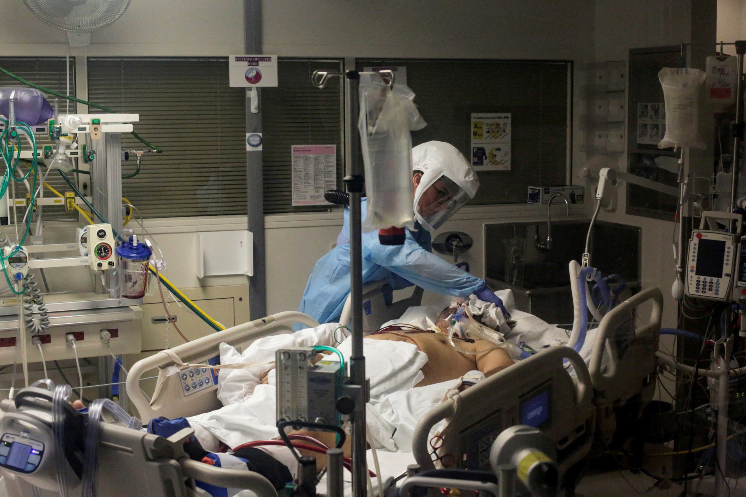 FILE PHOTO: Nurse Leah Silver cares for a coronavirus disease (COVID-19) patient in the COVID ICU at the University of Washington Medical Center - Montlake during the COVID-19 outbreak in Seattle, Washington, U.S. April 24, 2020.  REUTERS