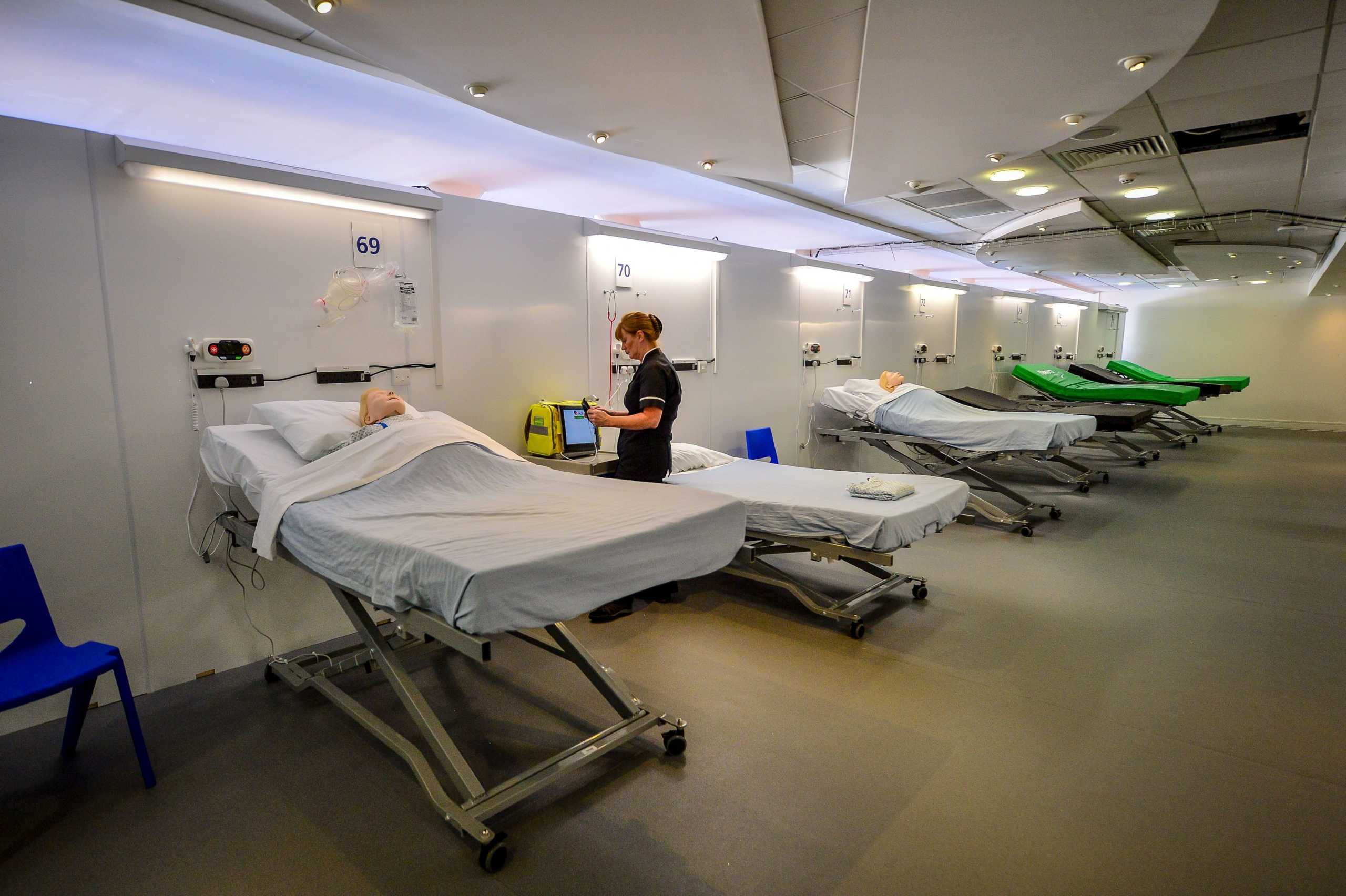 A simulation technician takes part in medical training inside a ward at the official opening of the new Dragon's Heart Hospital, built at the Principality Stadium to care for coronavirus patients amid the coronavirus disease (COVID-19) outbreak, in Cardiff, Britain, April 20, 2020. Picture taken April 20, 2020. Ben Birchall