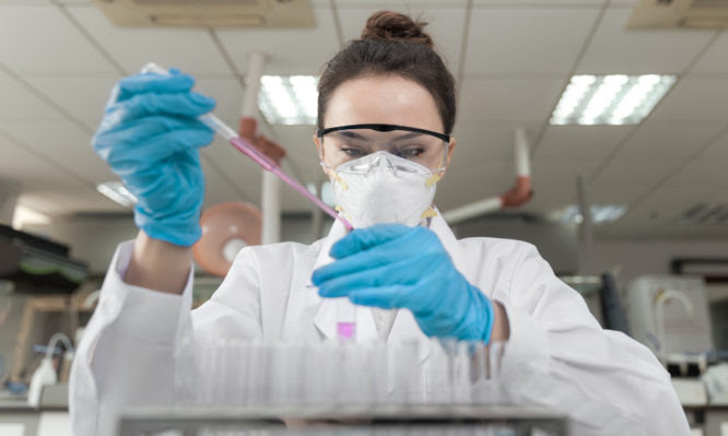 Female scientist working in the CDC laboratory.