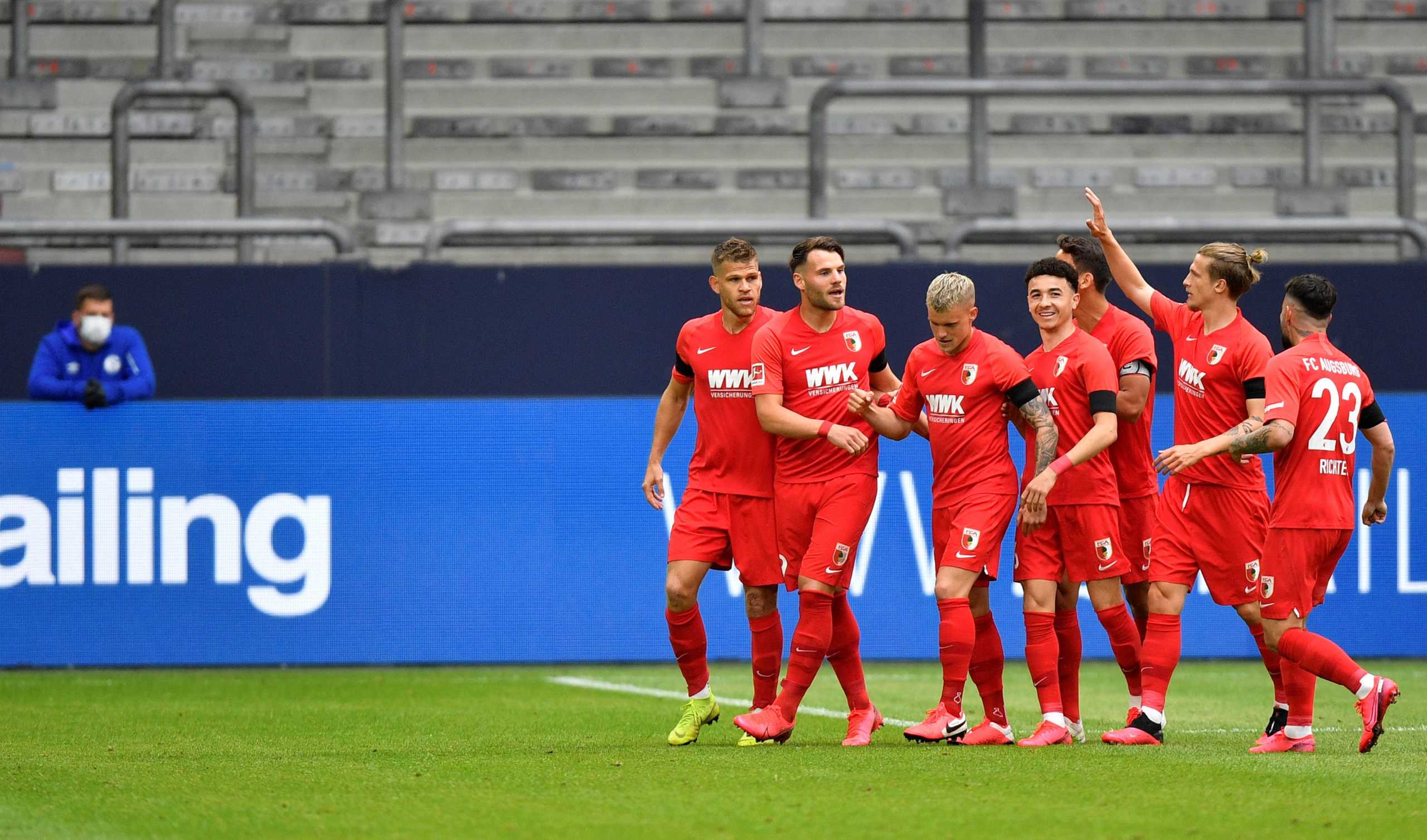Soccer Football - Bundesliga - Schalke 04 v FC Augsburg - Veltins-Arena, Gelsenkirchen, Germany - May 24, 2020 FC Augsburg's Eduard Lowen celebrates scoring their first goal with teammates as play resumes behind closed doors following the outbreak of the coronavirus disease (COVID-19) Martin Meissner