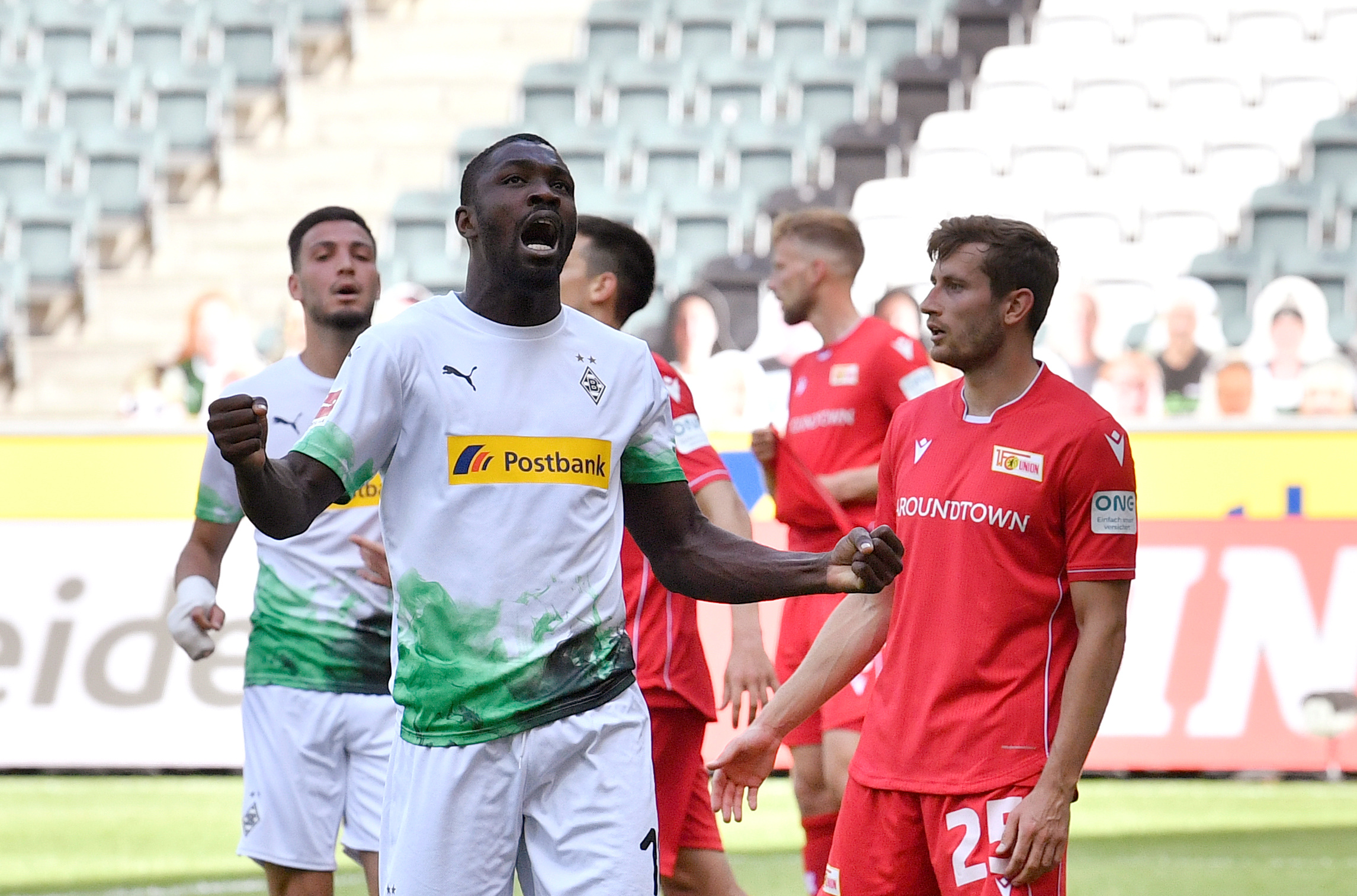 Soccer Football - Bundesliga - Borussia Moenchengladbach v 1. FC Union Berlin - Borussia-Park, Moenchengladbach, Germany - May 31, 2020 Borussia Moenchengladbach's Marcus Thuram celebrates scoring their second goal, as play resumes behind closed doors following the outbreak of the coronavirus disease (COVID-19) Martin Meissner