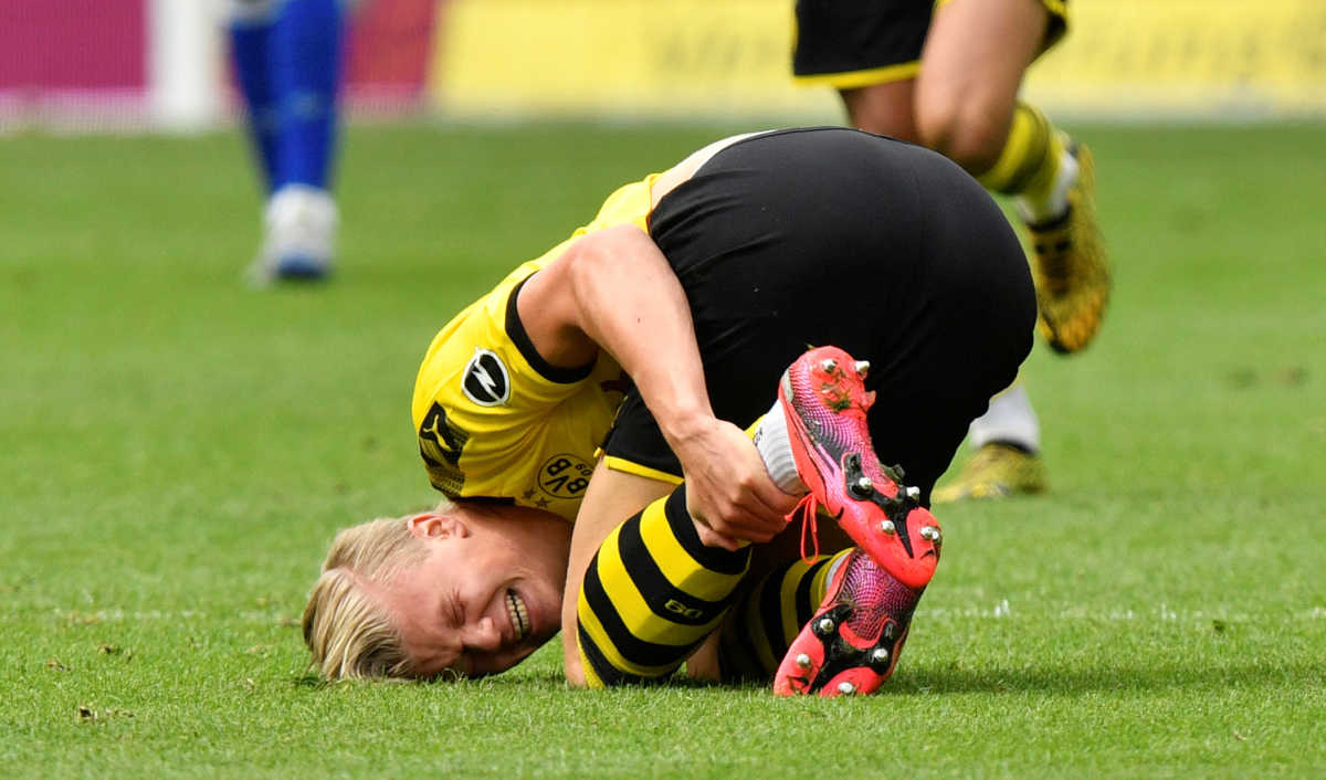 Soccer Football - Bundesliga - Borussia Dortmund v Schalke 04 - Signal Iduna Park, Dortmund, Germany - May 16, 2020 Dortmund's Erling Braut Haaland down injured, as play resumes behind closed doors following the outbreak of the coronavirus disease (COVID-19) Martin Meissner