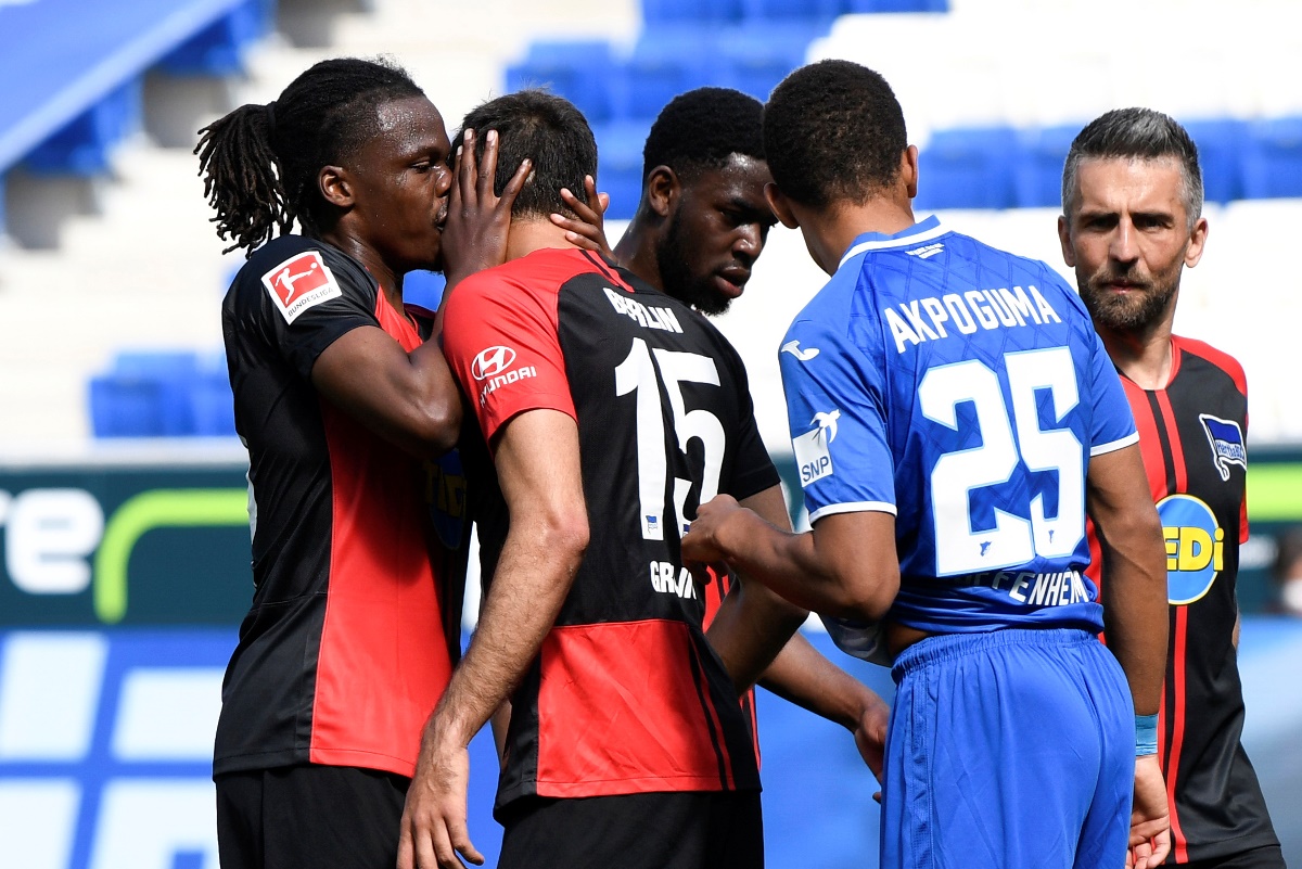 Soccer Football - Bundesliga - TSG 1899 Hoffenheim v Hertha BSC - PreZero Arena, Sinsheim, Germany - May 16, 2020 Hertha Berlin's Dedryck Boyata with Marko Grujic, as play resumes behind closed doors following the outbreak of the coronavirus disease (COVID-19) Thomas Kienzle