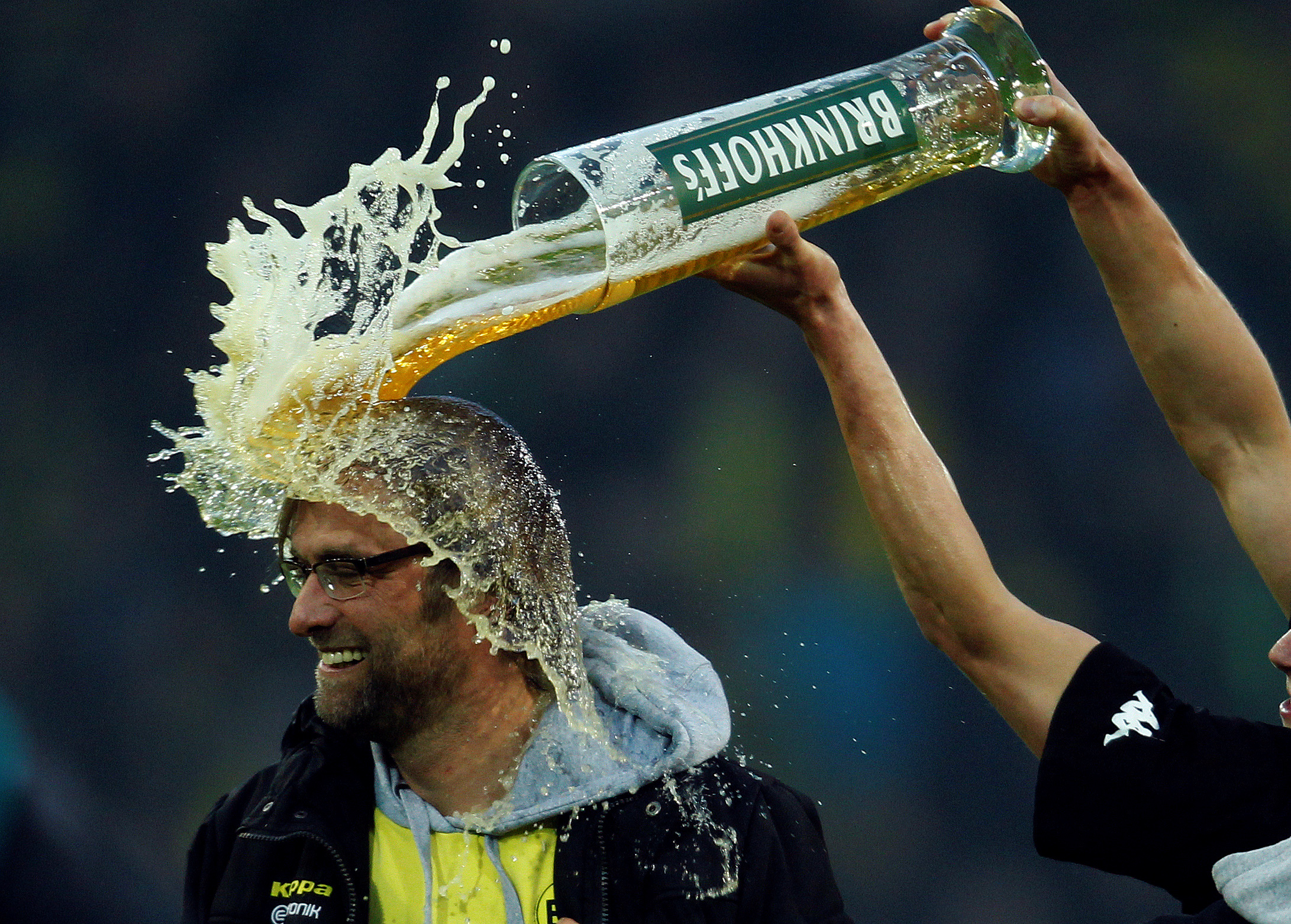 FILE PHOTO: ON THIS DAY -- April 21  April 21, 2012     SOCCER - Borussia Dortmund's Lukasz Piszczek pours beer over coach Juergen Klopp after his team secure their second straight German Bundesliga title with a 2-0 victory against Borussia Moenchengladbach in Dortmund.     Dortmund lost three of their opening six league games but strung together a 28-match unbeaten run to pip Bayern Munich to the title. They went on to defeat Bayern in the DFB Pokal to complete a league and cup double.     Klopp left Dortmund in 2015 to join Liverpool and has since won the Champions League, the UEFA Super Cup and Club World Cup with the Premier League side. REUTERS