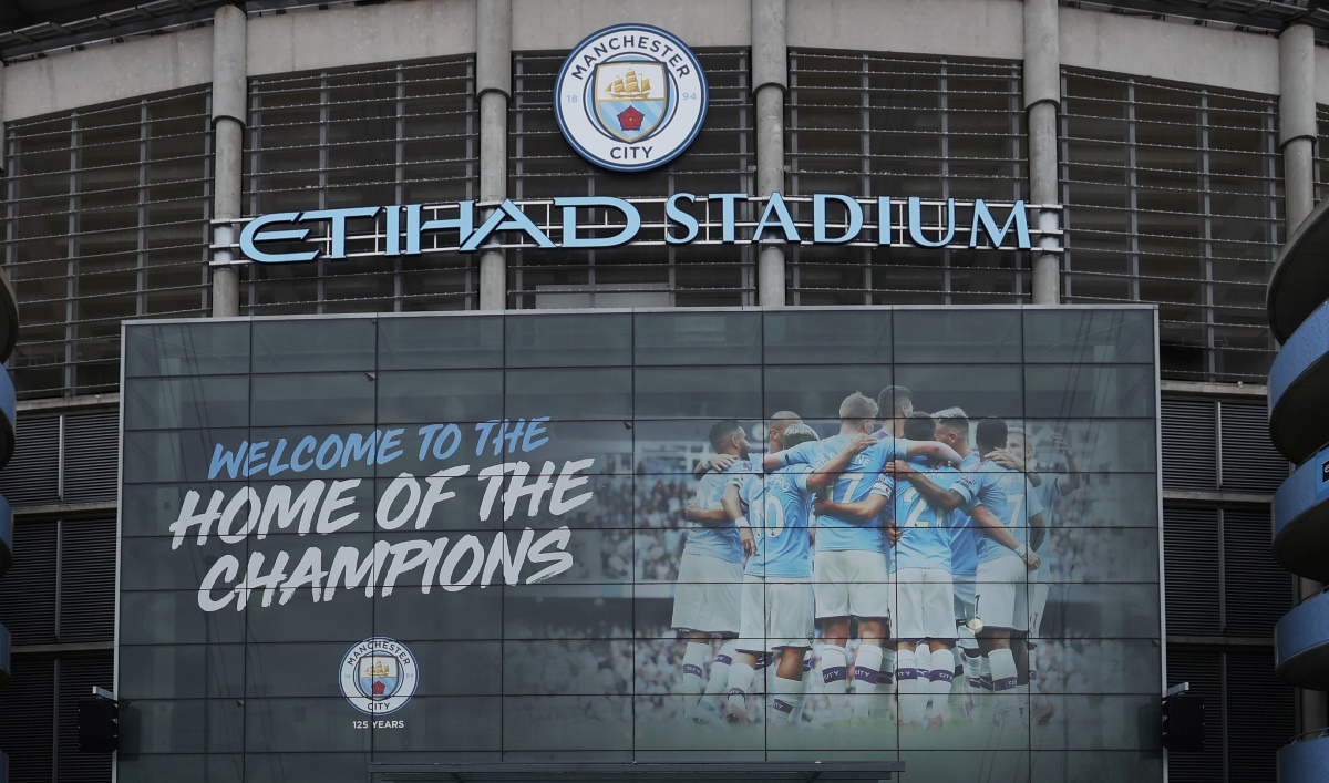 Soccer Football - Premier League - Today would have been the final fixtures of the season - Etihad Stadium, Manchester, Britain - May 17, 2020   A man is seen running outside the stadium at the time the final match of season between Manchester City and Norwich City was due to take place before it was postponed due to the outbreak of the coronavirus disease (COVID-19)   REUTERS