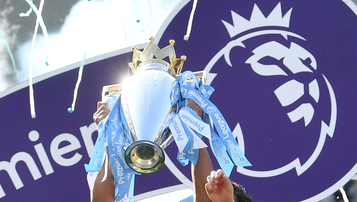 FILE PHOTO: ON THIS DAY -- May 12  May 12, 2019     SOCCER - Manchester City skipper Vincent Kompany lifts the trophy as they celebrate defending the Premier League title following a 4-1 victory at Brighton & Hove Albion.     City, who had clinched the League Cup earlier in the season, completed a unique domestic treble by winning the FA Cup final 6-0 against Watford the following weekend to become the first English team to achieve the feat.     Belgian defender Kompany, who guided City to four league titles, two FA Cups and four League Cups, left Pep Guardiola's team at the end of the campaign to join Anderlecht as their player-manager. REUTERS