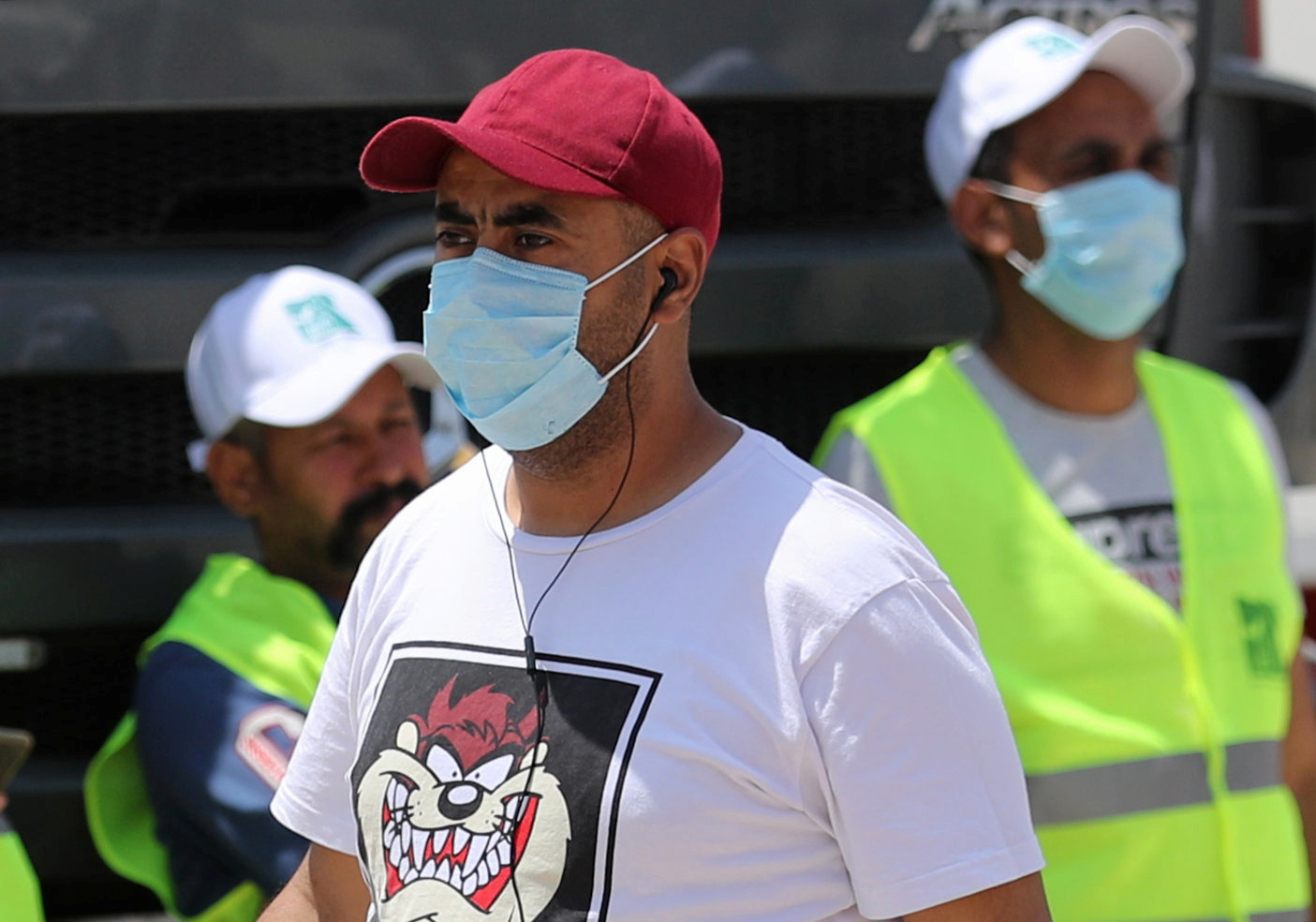 Men wearing protective face masks are pictured in downtown Cairo, amidst concerns about the spread of the coronavirus disease (COVID-19), Egypt, May 2, 2020. REUTERS