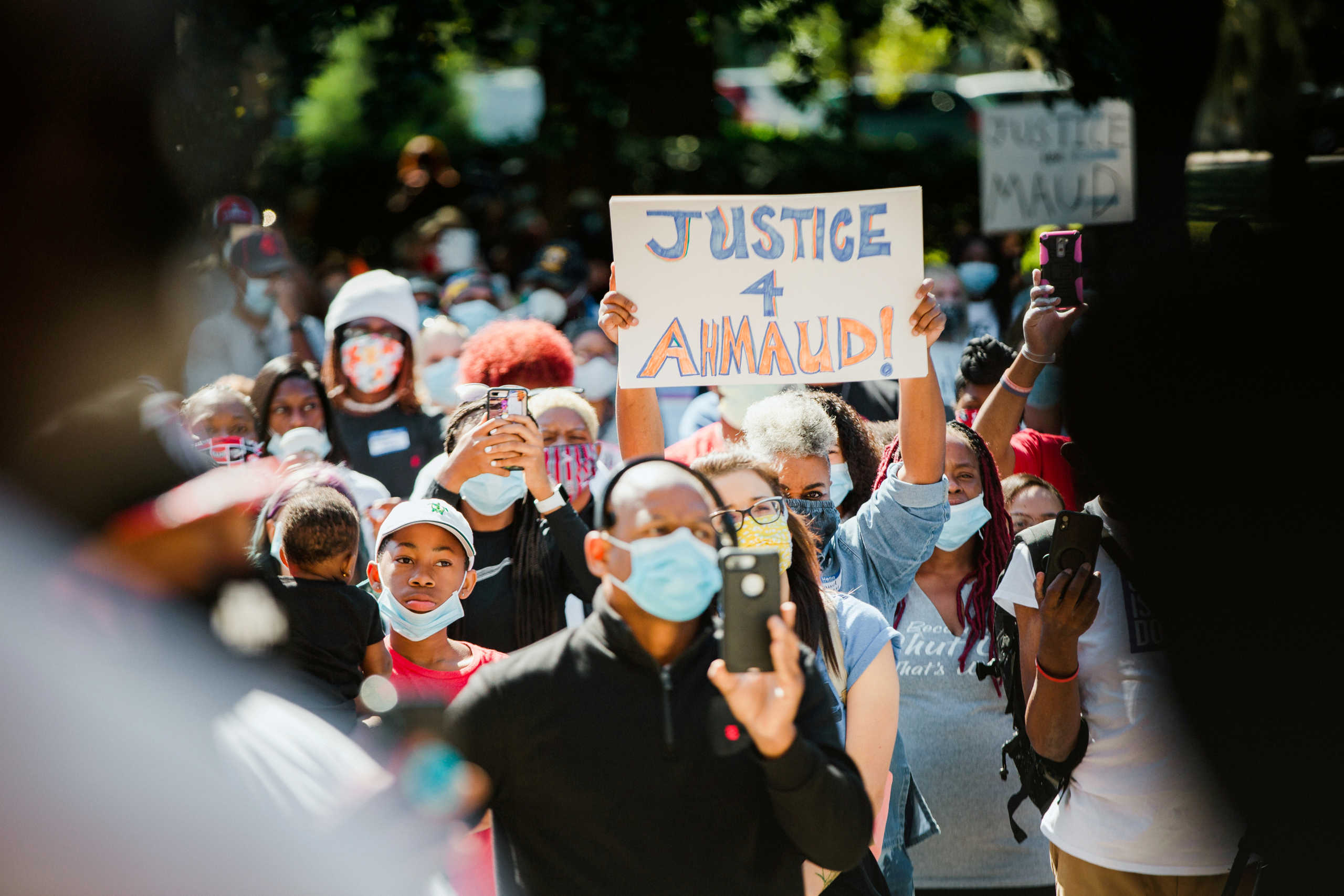 Supporters of the Georgia NAACP (National Association for the Advancement of Colored People) wearing protective masks protest after the death in February of Ahmaud Arbery, an unarmed young black man shot after being chased by a white former law enforcement officer and his son, at the Glynn County Courthouse in Brunswick, Georgia, U.S., May 8, 2020. REUTERS