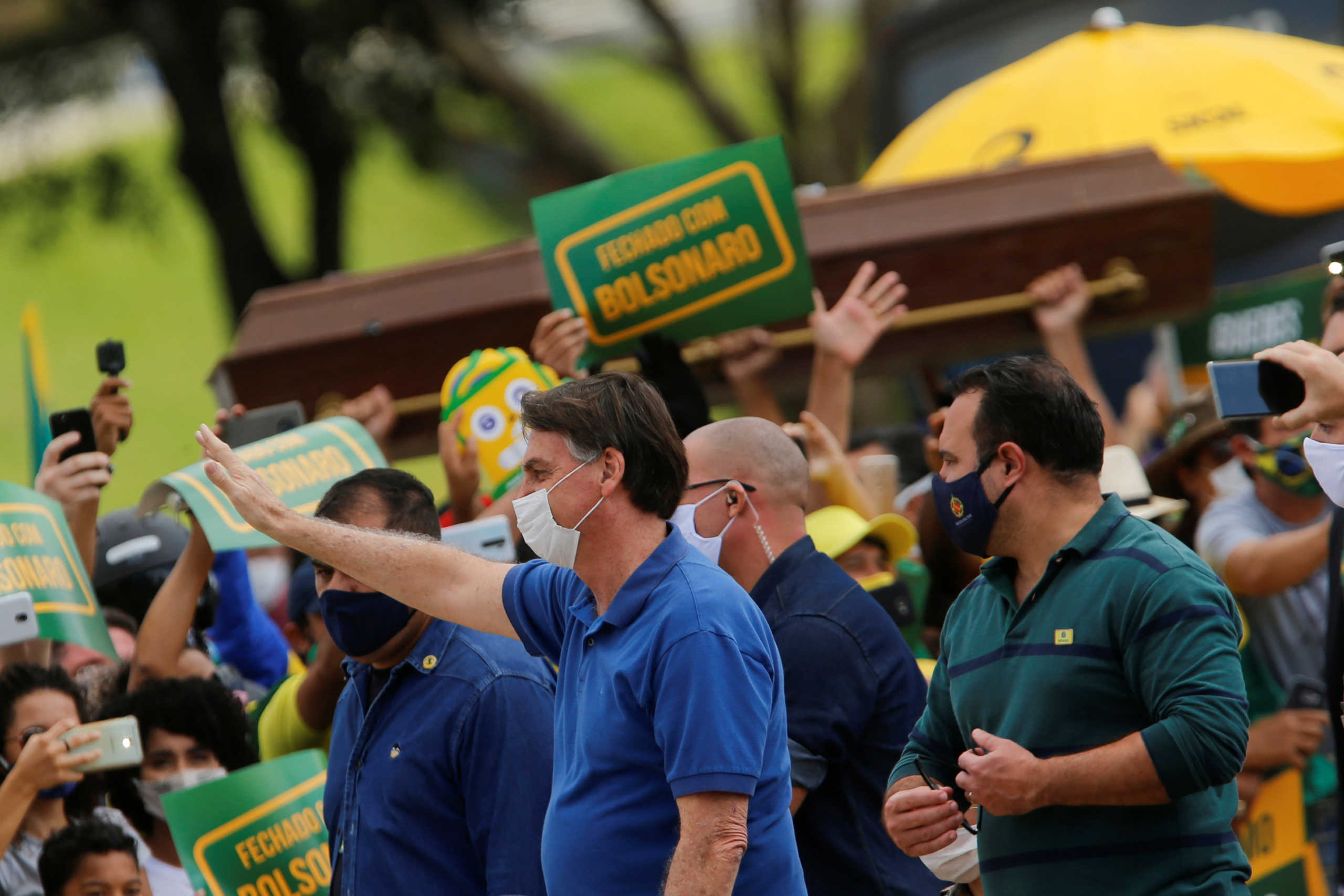 Brazil's President Jair Bolsonaro greets supporters during a protest against the President of the Chamber of Deputies Rodrigo Maia, Brazilian Supreme Court, quarantine and social distancing measures, amid the coronavirus disease (COVID-19) outbreak, in Brasilia, Brazil May 17, 2020. REUTERS