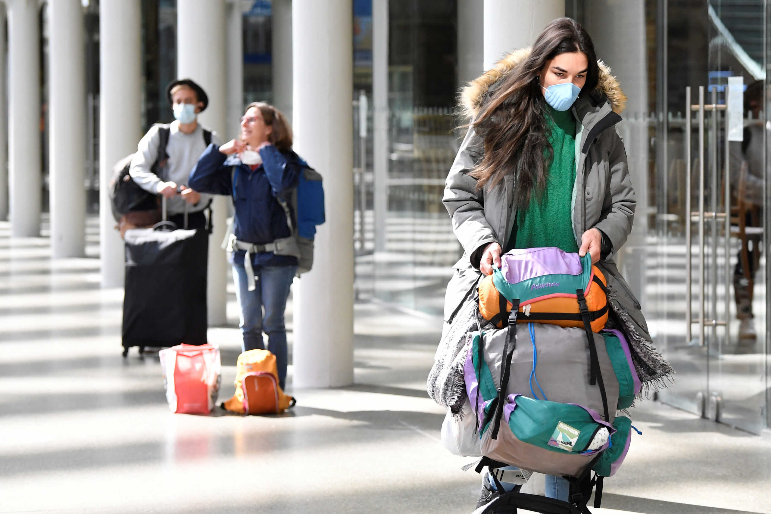 Passengers wearing protective face masks queue at St Pancras Eurostar station in London, On the first day that it has become compulsory to wear a face mask when travelling on Eurostar trains to France and Belgium, following the outbreak of the coronavirus disease (COVID-19), London, Britain, May 4, 2020. REUTERS