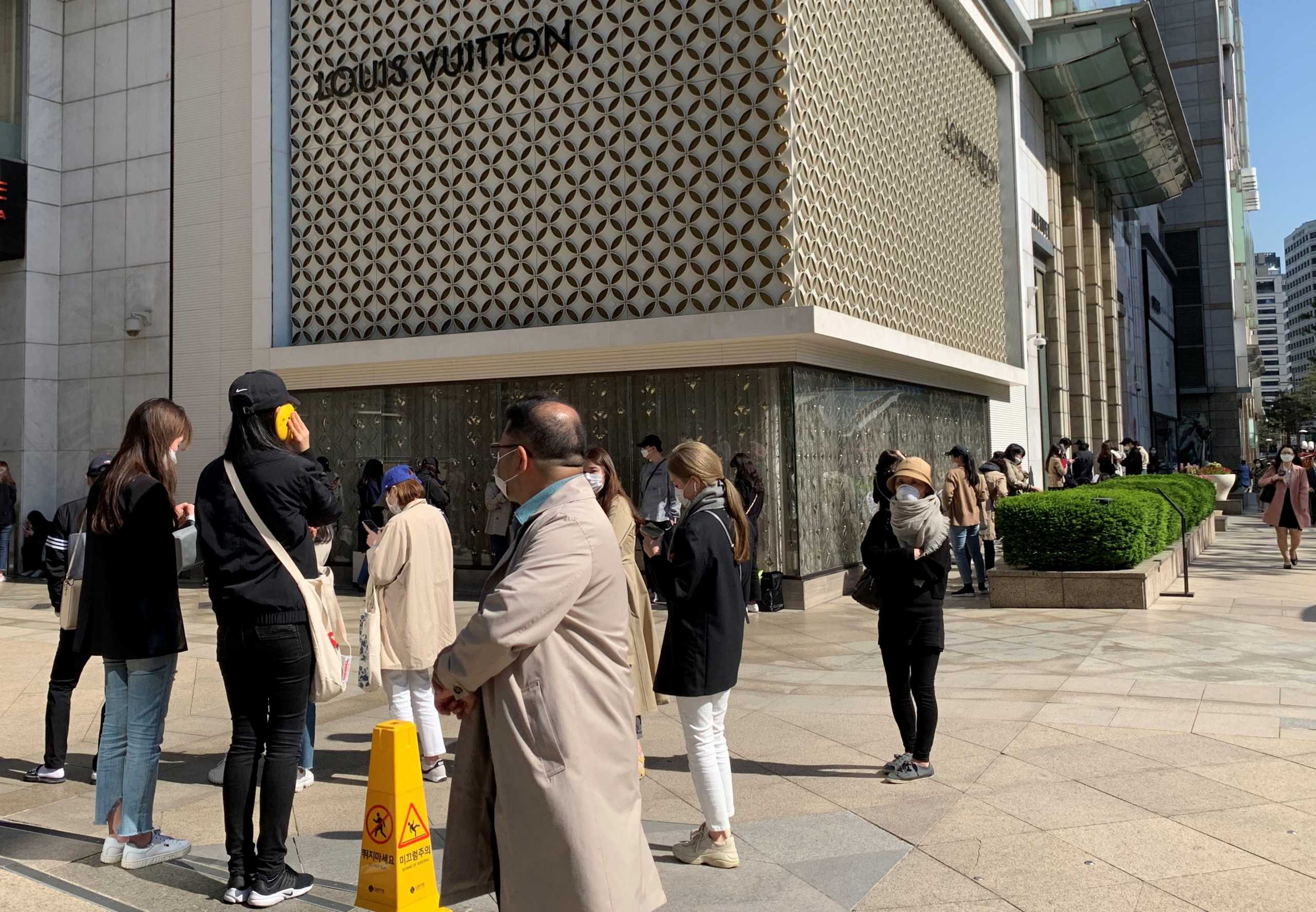People queue to enter the Chanel boutique at a department store amid the coronavirus disease (COVID-19) outbreak, in Seoul, South Korea, May 13, 2020. REUTERS
