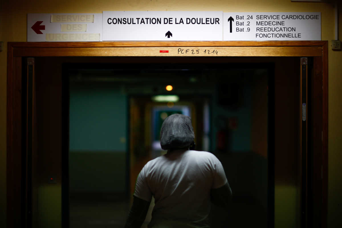 A nurse walks at the Robert Ballanger hospital in Aulnay-sous-Bois near Paris during the outbreak of the coronavirus disease (COVID-19) in France, May 5, 2020. Seine-Saint-Denis, a mainly working class and multiracial suburb, was already lacking doctors and resources before the coronavirus crisis and has seen a bigger spike in mortality than neighbouring Paris. But despite being understaffed, teams at Robert Ballanger hospital reorganized to prioritize emergency health and have worked long hours, giving everything to fight the virus. Picture taken May 5, 2020. REUTERS