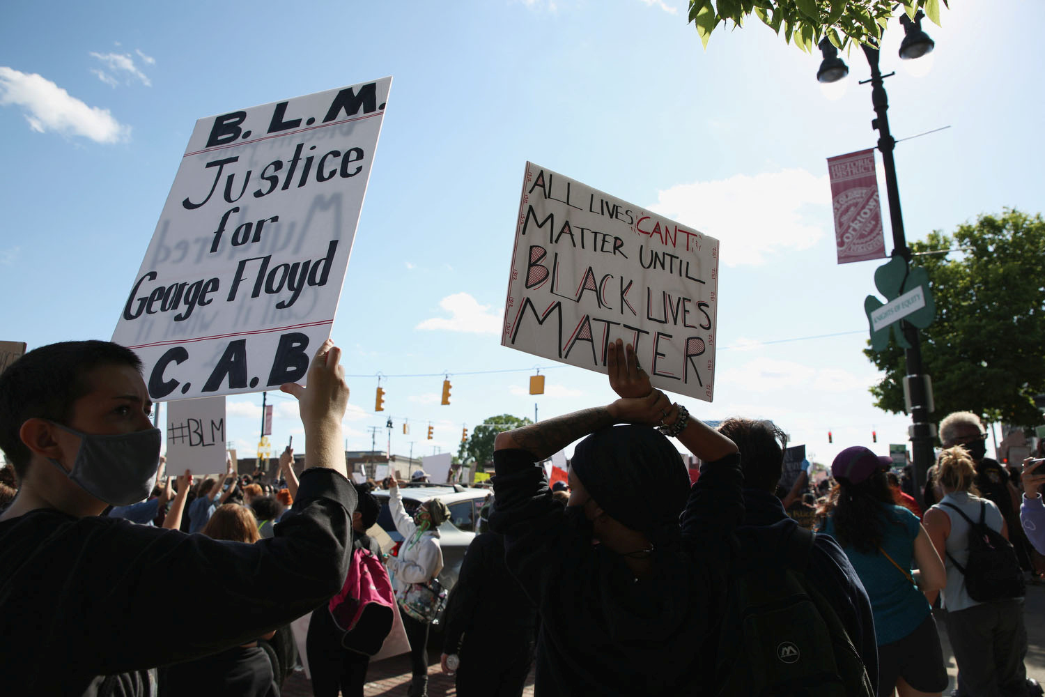 Protestors march along Michigan Ave. during a protest against the death in Minneapolis police custody of African-American man George Floyd and the assault of Sha'Teina and Dan Grady El by Washtenaw County police, in Detroit, Michigan, U.S. May 29, 2020. REUTERS
