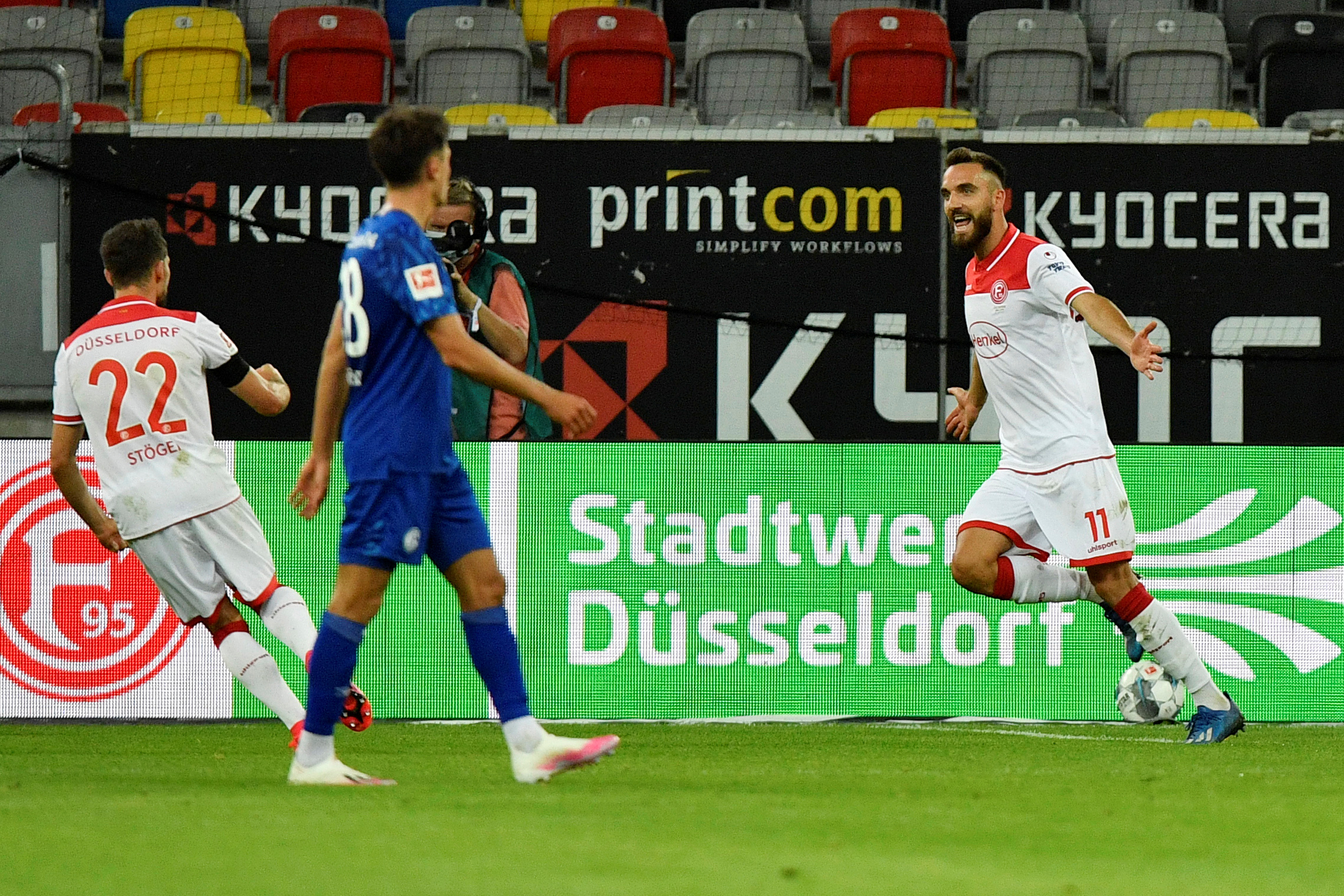 Soccer Football - Bundesliga - Fortuna Dusseldorf v Schalke 04 - Merkur Spiel-Arena, Dusseldorf, Germany - May 27, 2020   Fortuna Dusseldorf's Kenan Karaman celebrates scoring their second goal, as play resumes following the outbreak of the coronavirus disease (COVID-19) Martin Meissner