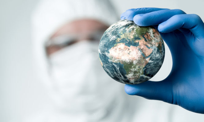 Pandemic concept, close up of scientist holdnig and analyzing planet earth