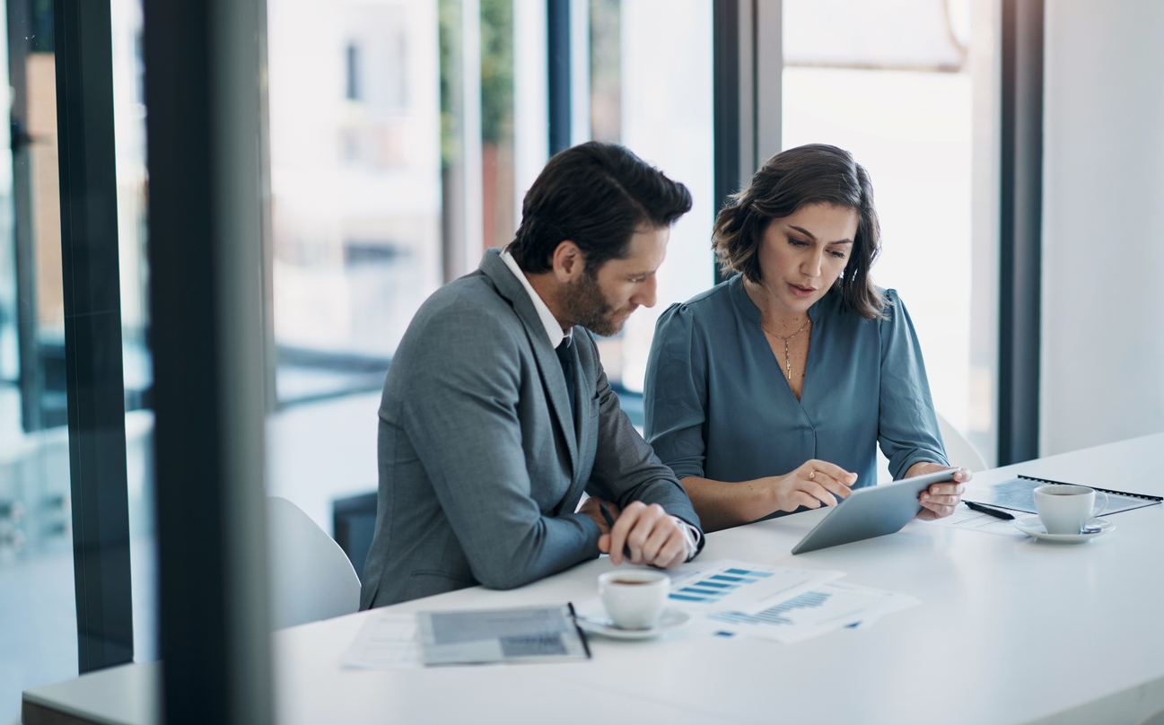 Business people, teamwork and tablet for statistics, finance report and planning of revenue, profit or sales in office. Professional advisor or clients with data analytics, graphs and digital charts
