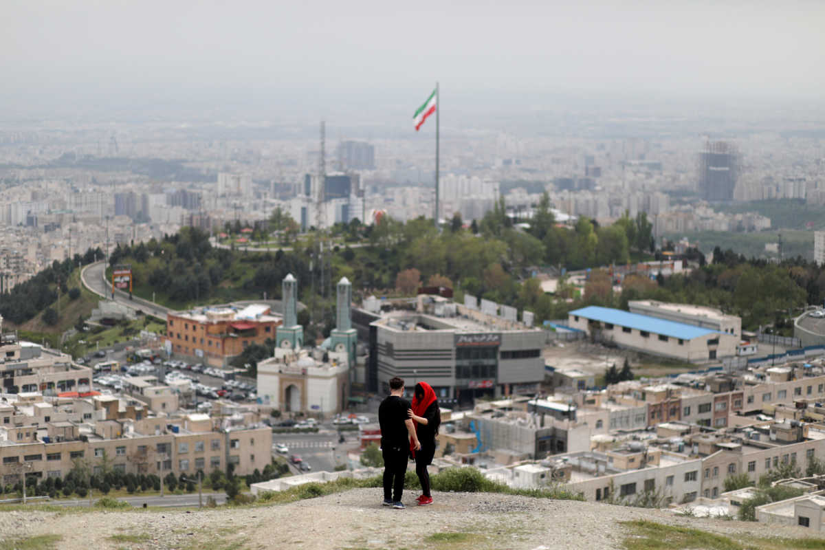 FILE PHOTO: An Iranian couple is seen following the outbreak of the coronavirus disease (COVID-19), in Tehran, Iran, April 30, 2020. WANA (West Asia News Agency)