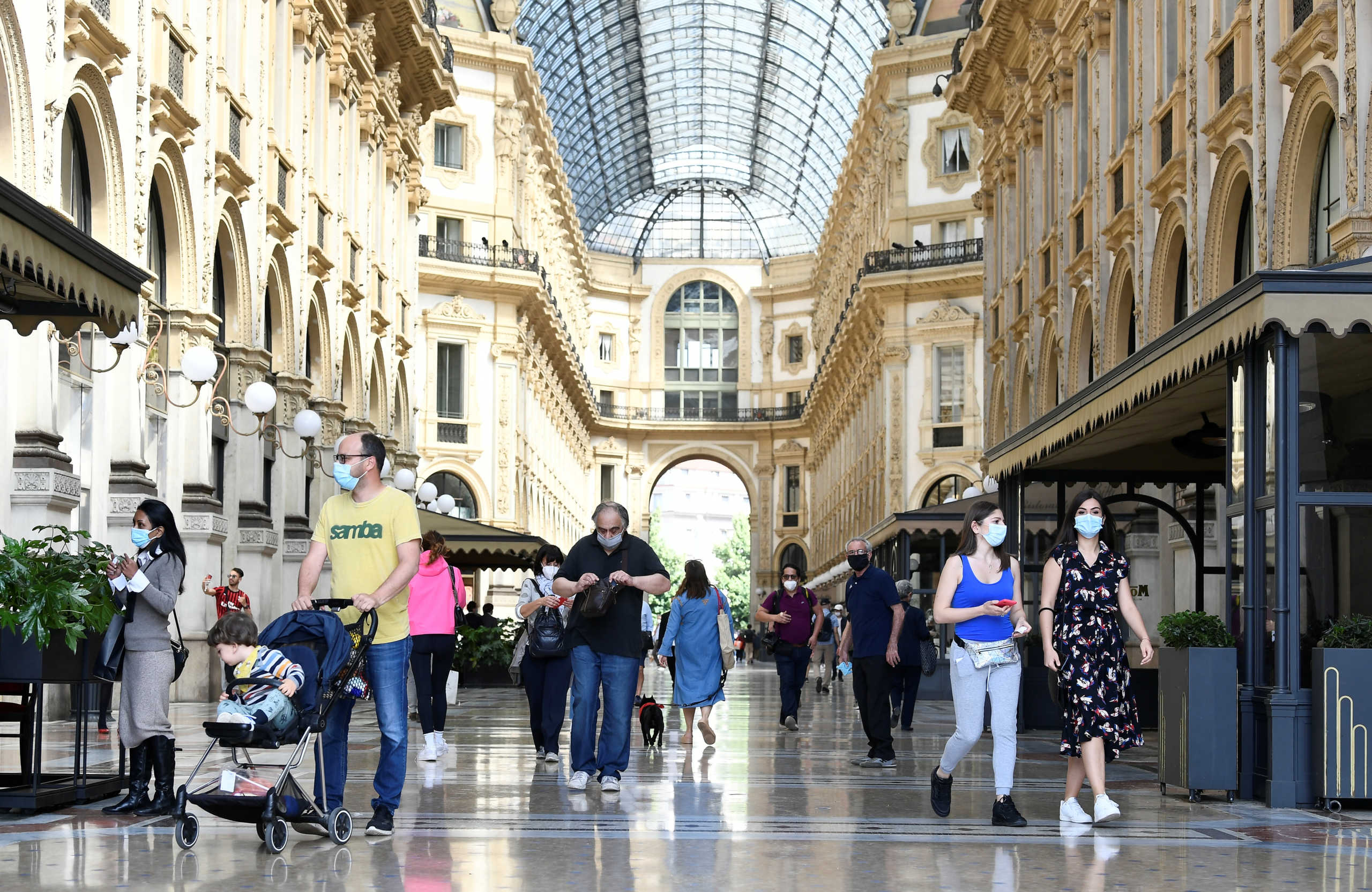 People walk at at Galleria Vittorio Emanuele II, as Italy eases some of the lockdown measures put in place during the coronavirus disease (COVID-19) outbreak, in Milan, Italy May 18, 2020. REUTERS