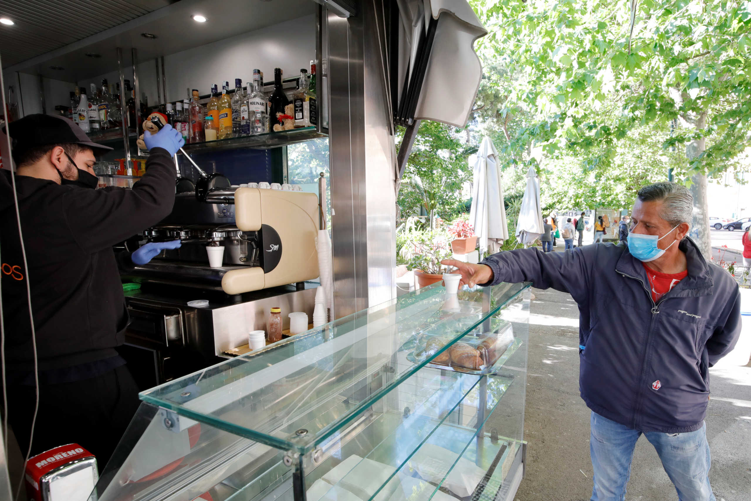 A bar reopens offering walk-in takeaway food and drinks as Italy begins a staged end to a nationwide lockdown due to a spread of the coronavirus disease (COVID-19), in Naples, Italy May 4, 2020. REUTERS
