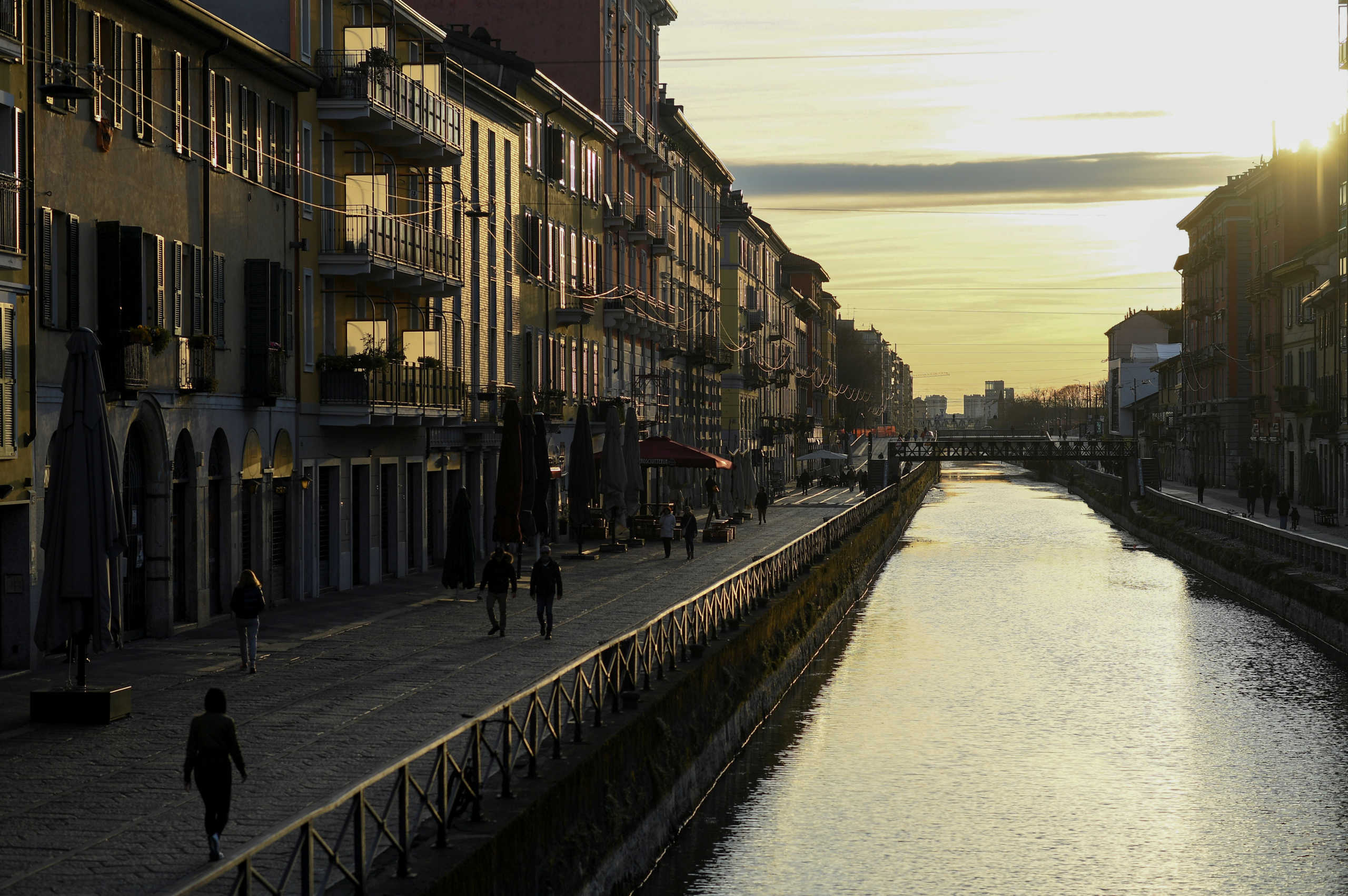 FILE PHOTO: A sunset in Navigli district is seen, after a decree orders for the whole of Italy to be on lockdown in an unprecedented clampdown aimed at beating the coronavirus,in Milan Italy, March 10, 2020. REUTERS