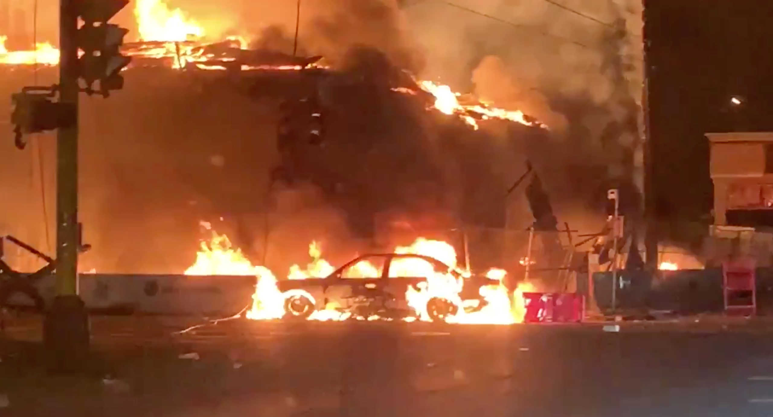 An AutoZone auto parts store is seen on fire, in Minneapolis, Minnesota, U.S., May 28, 2020, in this picture grab obtained from a social media video. TWITTER