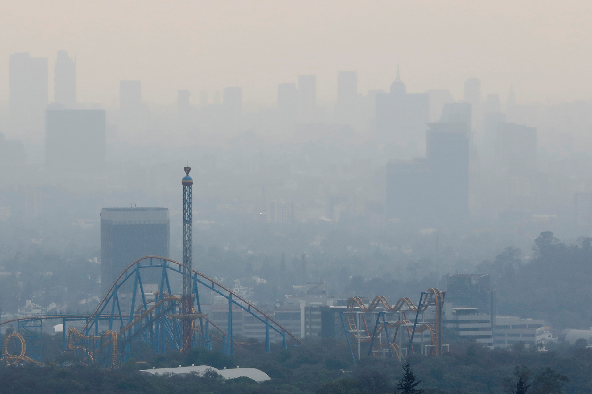 FILE PHOTO: A general view shows buildings during high levels of pollution in Mexico City, as the spread of the coronavirus disease (COVID-19) continues in Mexico City, Mexico April 19, 2020. REUTERS