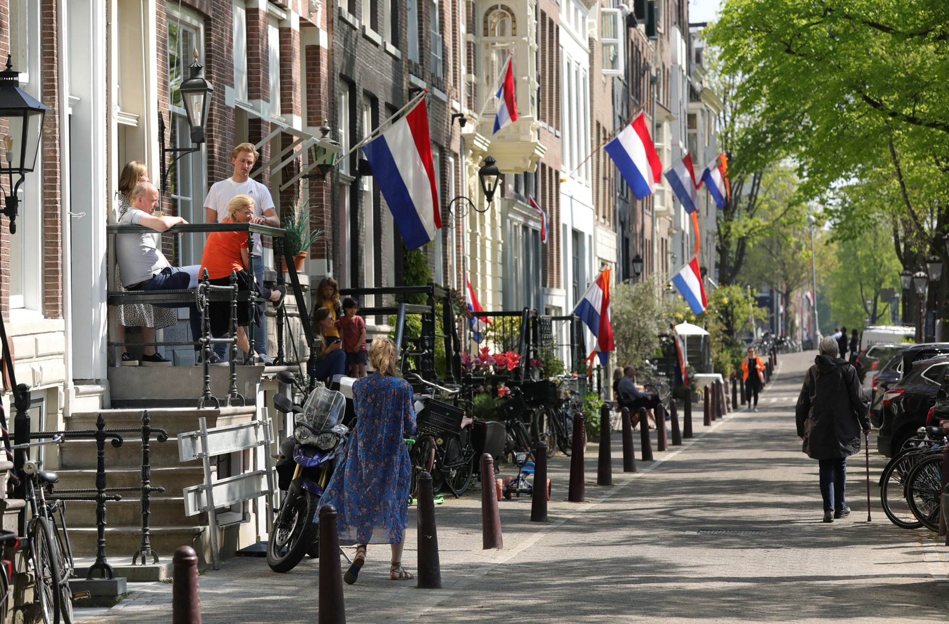 Dutch flags hang outside apartments to celebrate King's Day (Koningsdag), during the coronavirus disease (COVID-19) outbreak in Amsterdam, Netherlands, April 27, 2020. REUTERS