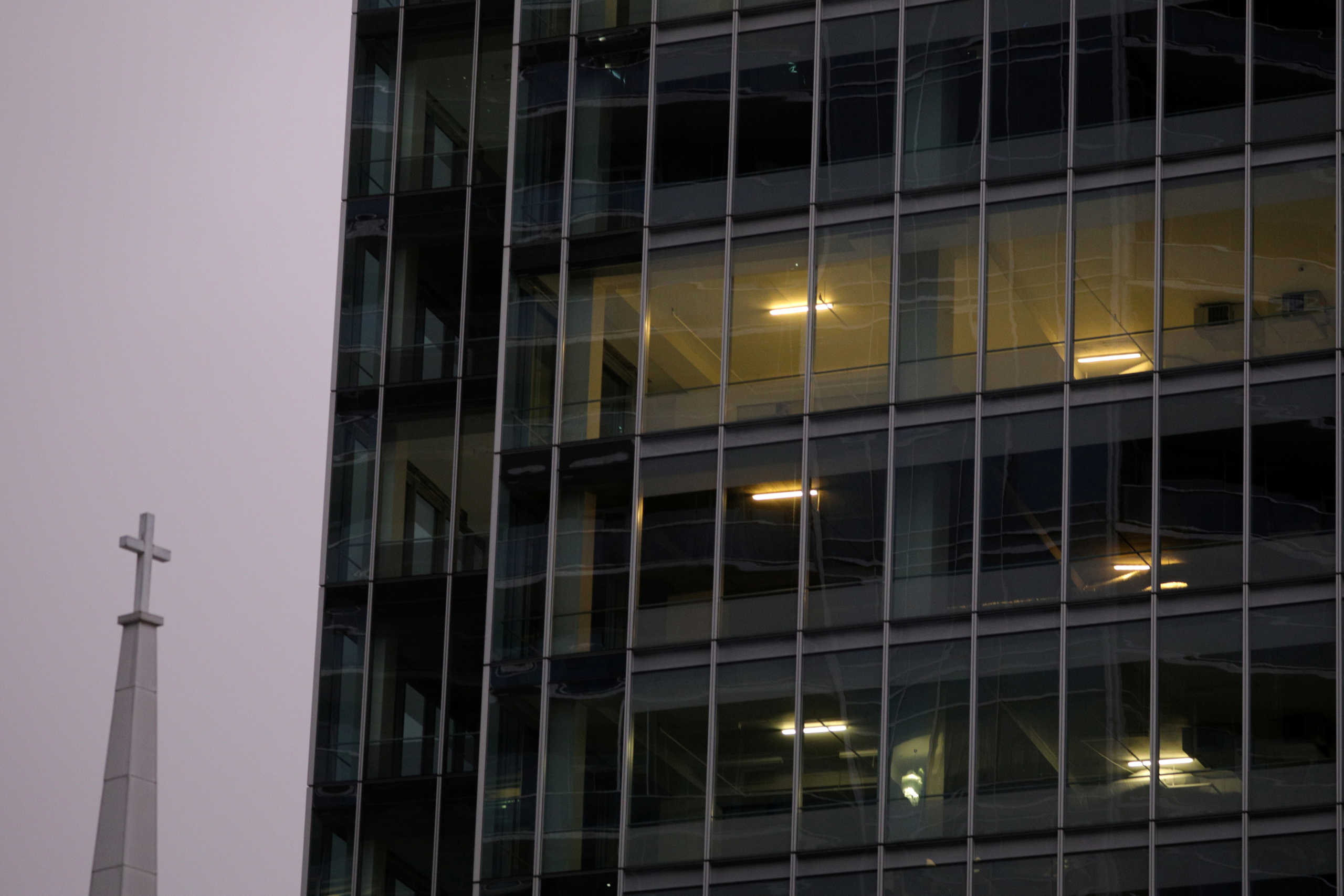 Office lights are illuminated in a high rise building at dusk, as Governor Ralph Northam's (D-VA) stay-at-home order continues due to the coronavirus disease (COVID-19) outbreak, in the Rosslyn section of Arlington, Virginia, U.S., April 30, 2020. REUTERS