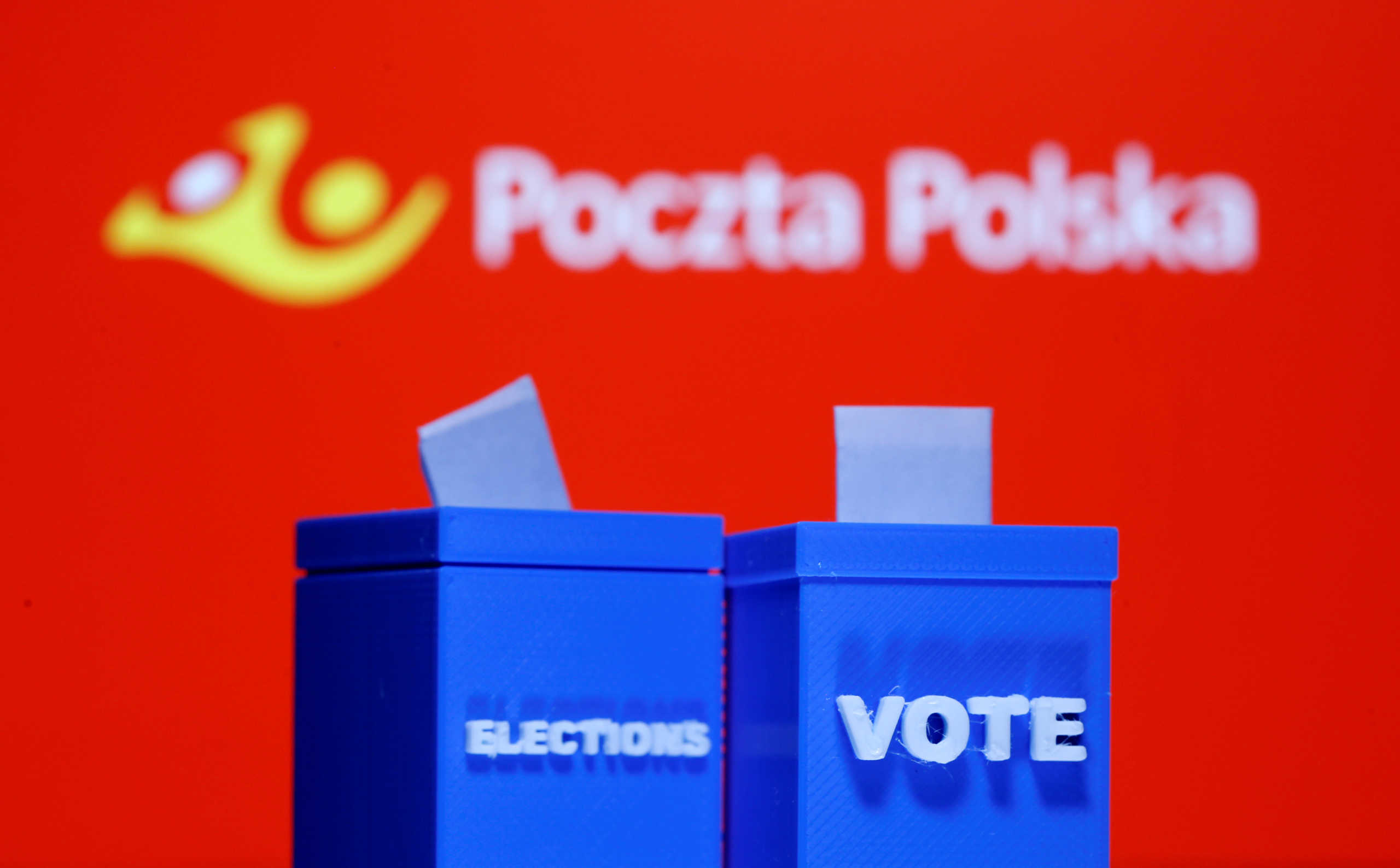 A 3D printed ballot boxes are seen in front of displayed Poczta Polska logo in this illustration taken May 4, 2020. REUTERS