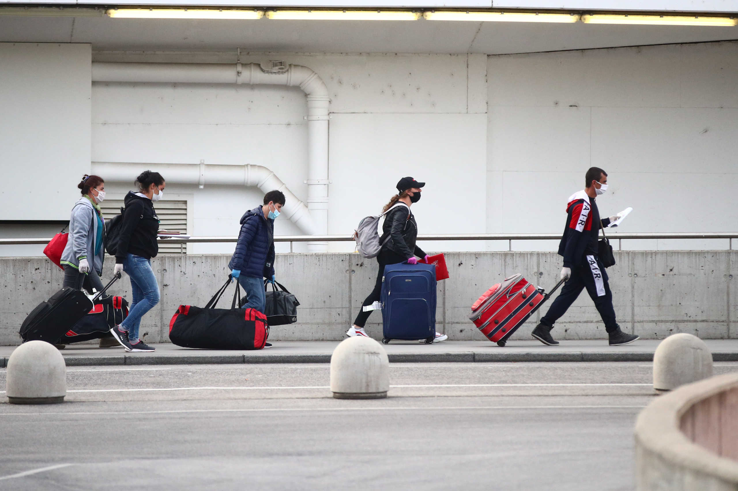 Workers from Romania arrive for the harvest season at Vienna International Airport during the spread of the coronavirus disease (COVID-19) in Schwechat, Austria, April 24, 2020. REUTERS